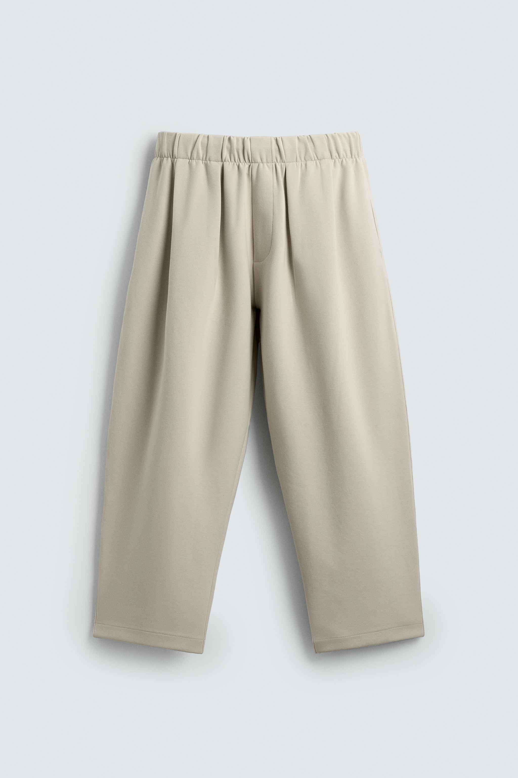 INTERLOCK PLEATED PANTS