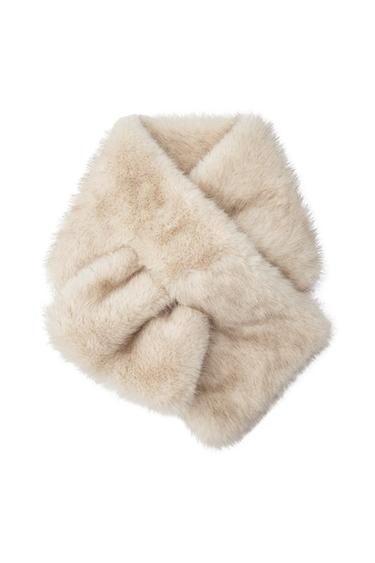 Front view of a beige plush scarf with a soft texture.