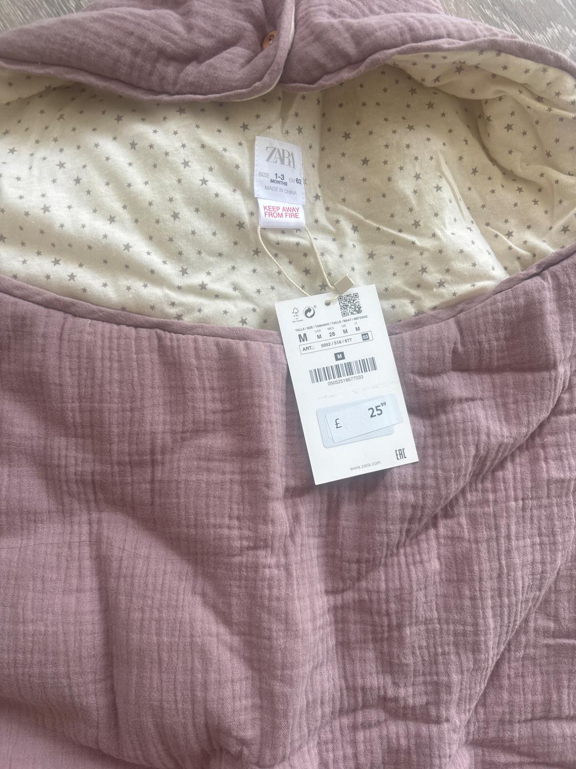 Pink padded garment with stars. Text: ZARA SIZE 1-3 CM 62 MONTHS MADE IN CHINA KEEP AWAY FROM FIRE £ 25.99