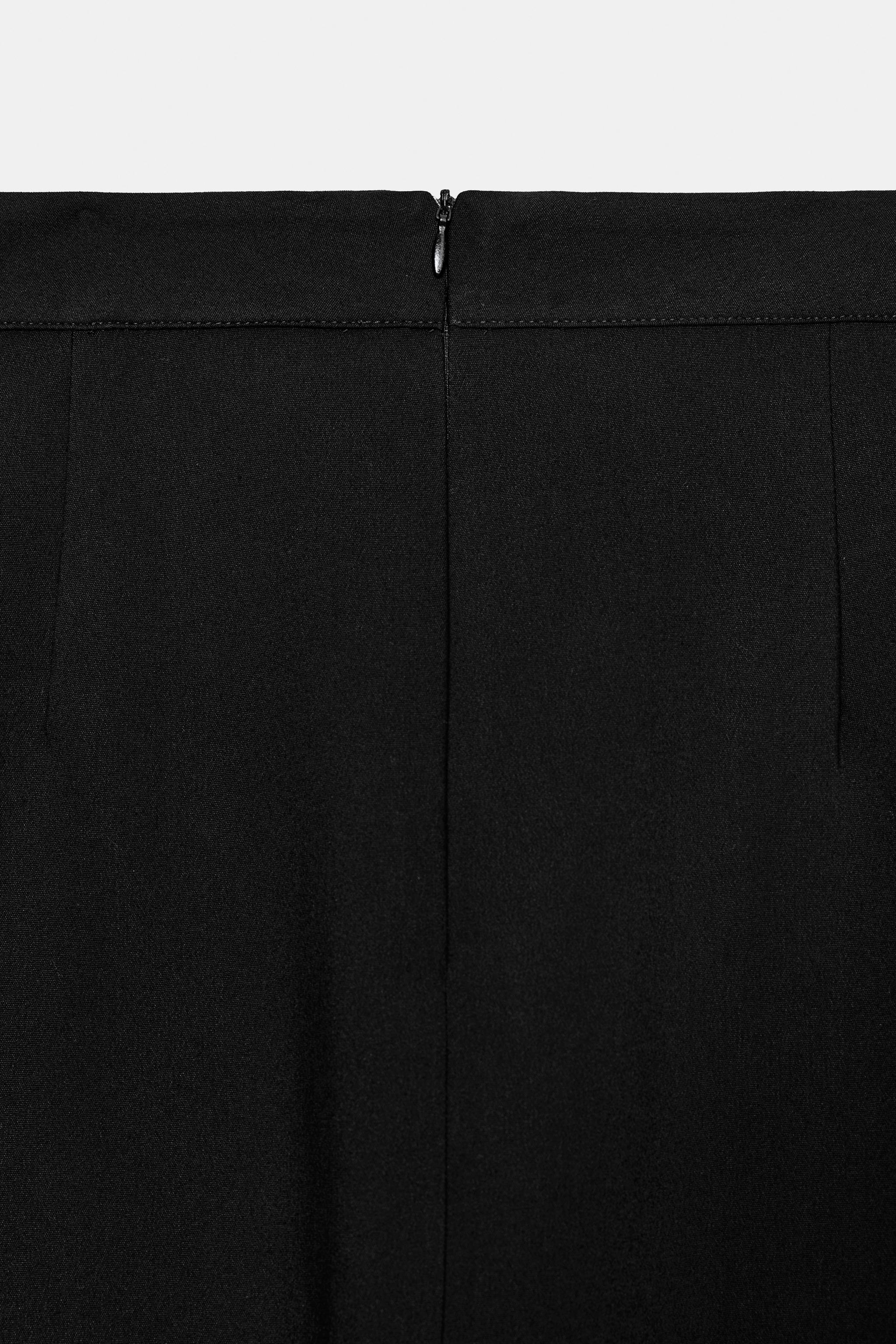 JUPE MI-LONGUE À OUVERTURE