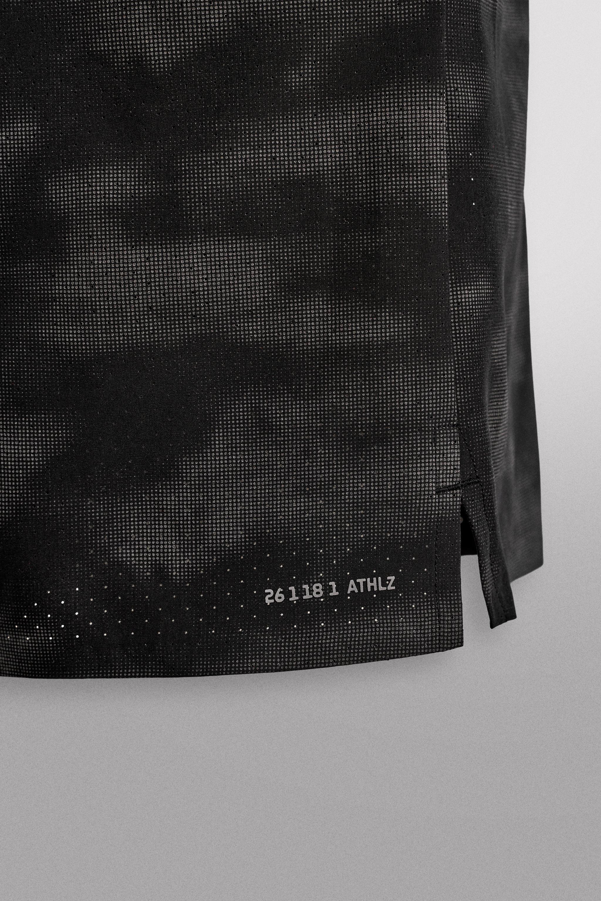 PERFORATED RUNNING SHORTS