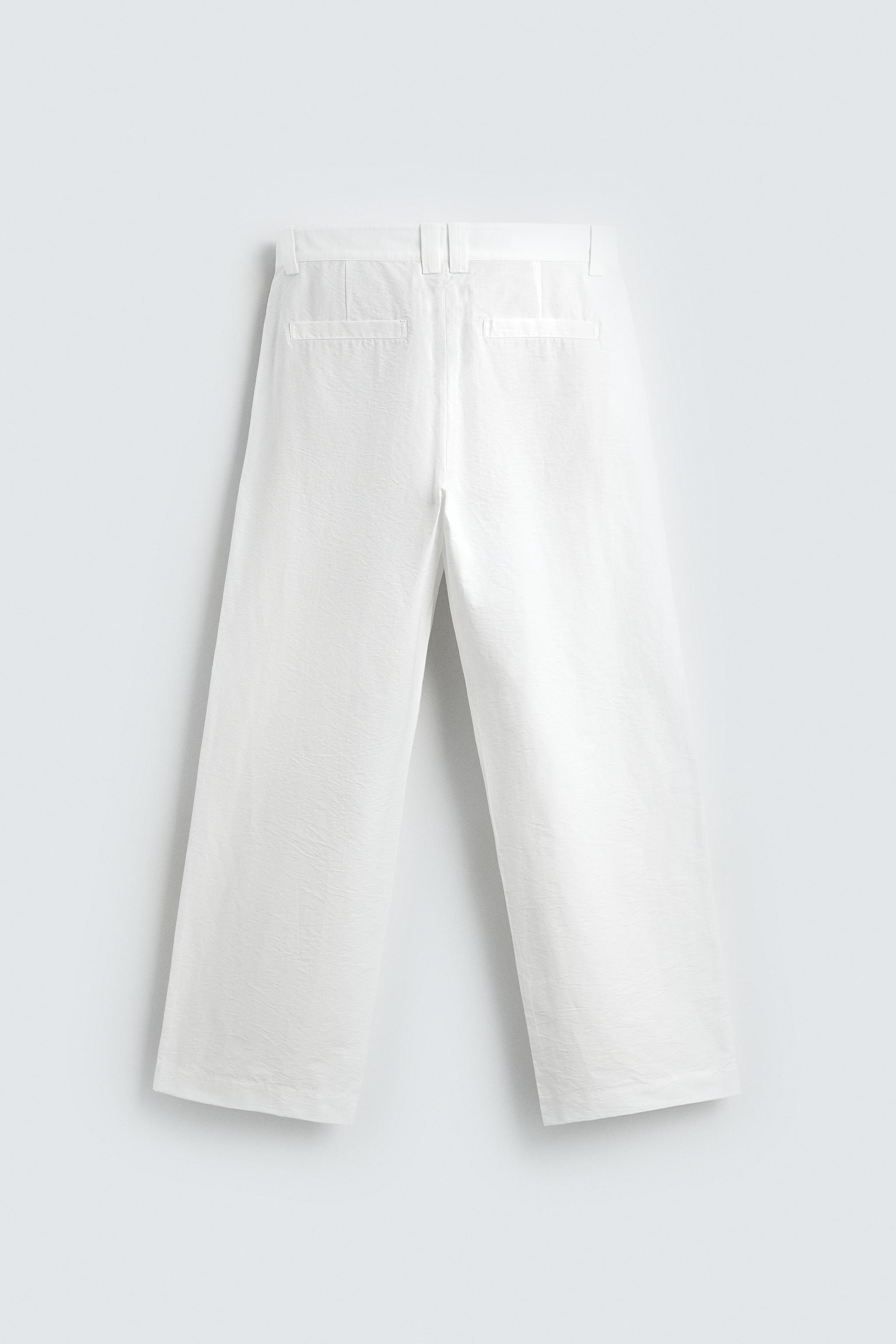 PANTALON COUPE LARGE À PLIS