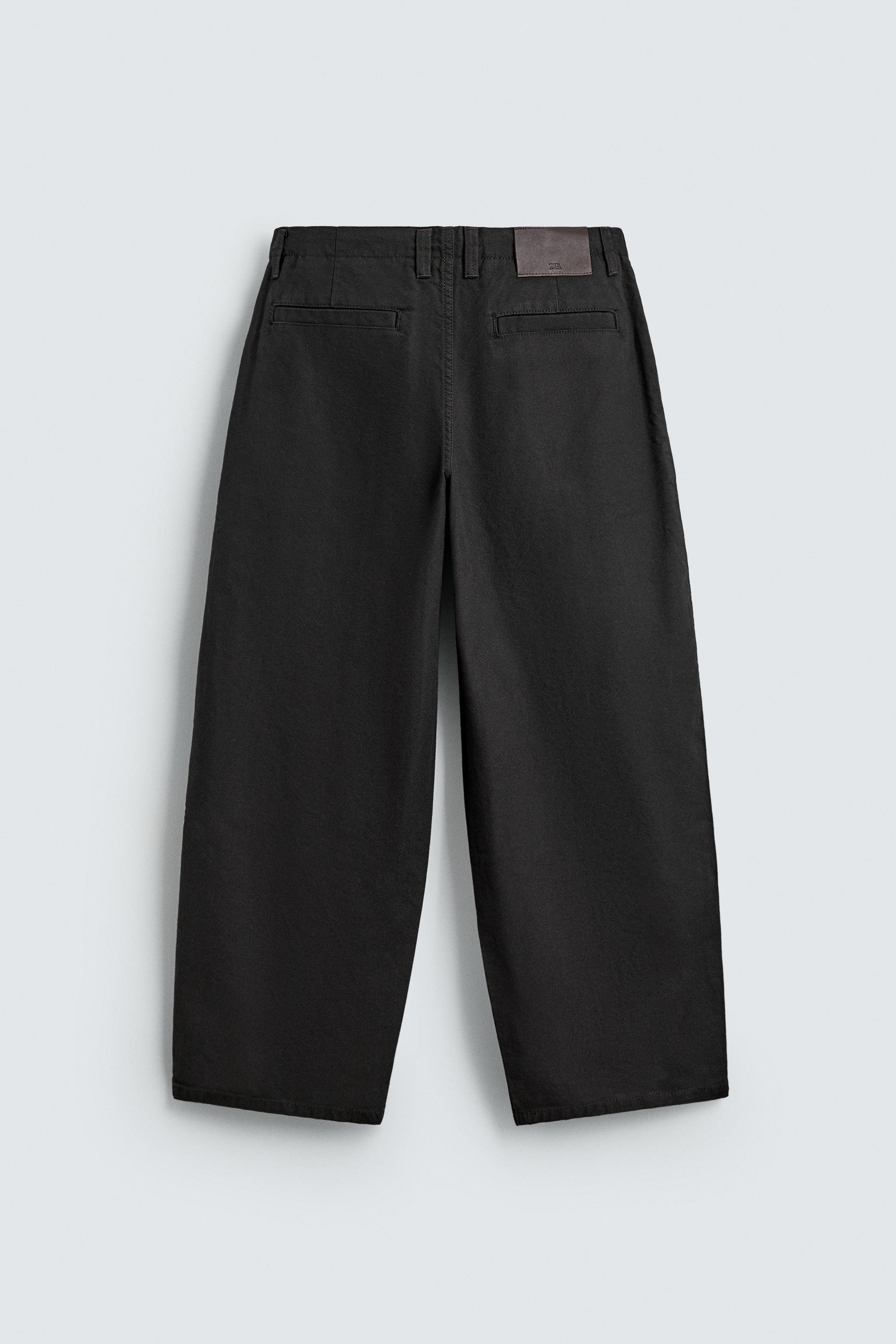 WIDE FIT PLEATED PANTS