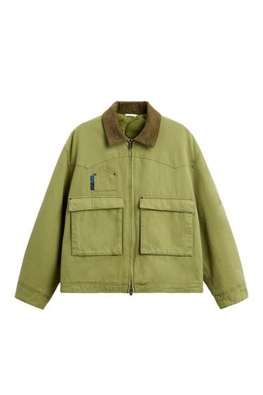 Front view of a green jacket with brown lapel and front pockets.