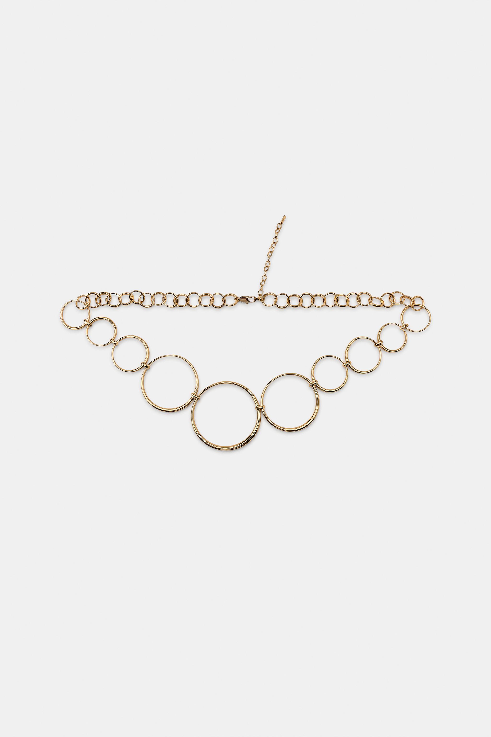 CEINTURE MÉTALLIQUE À ŒILLETS