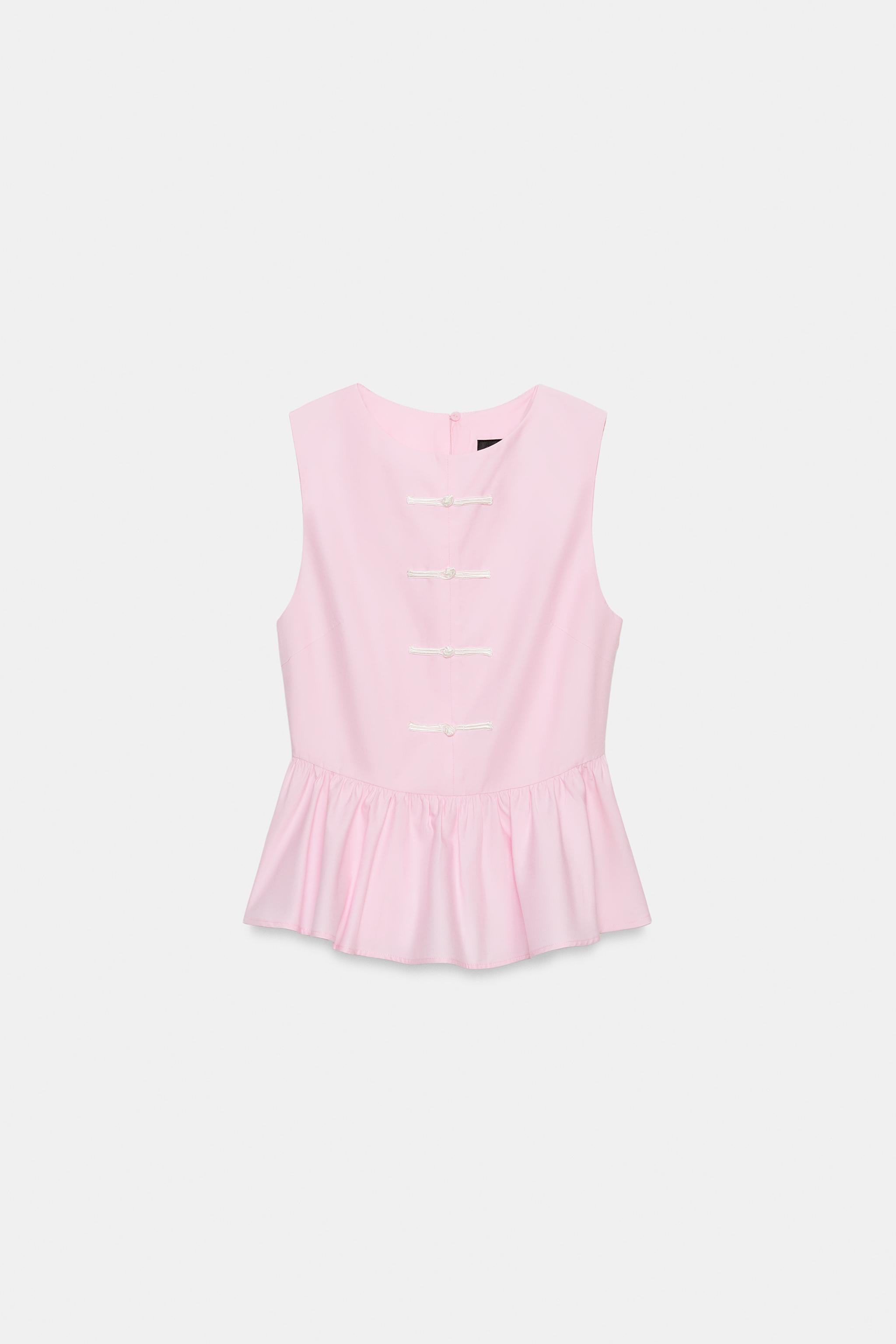 PEPLUM TOP WITH FIREMAN CLASPS
