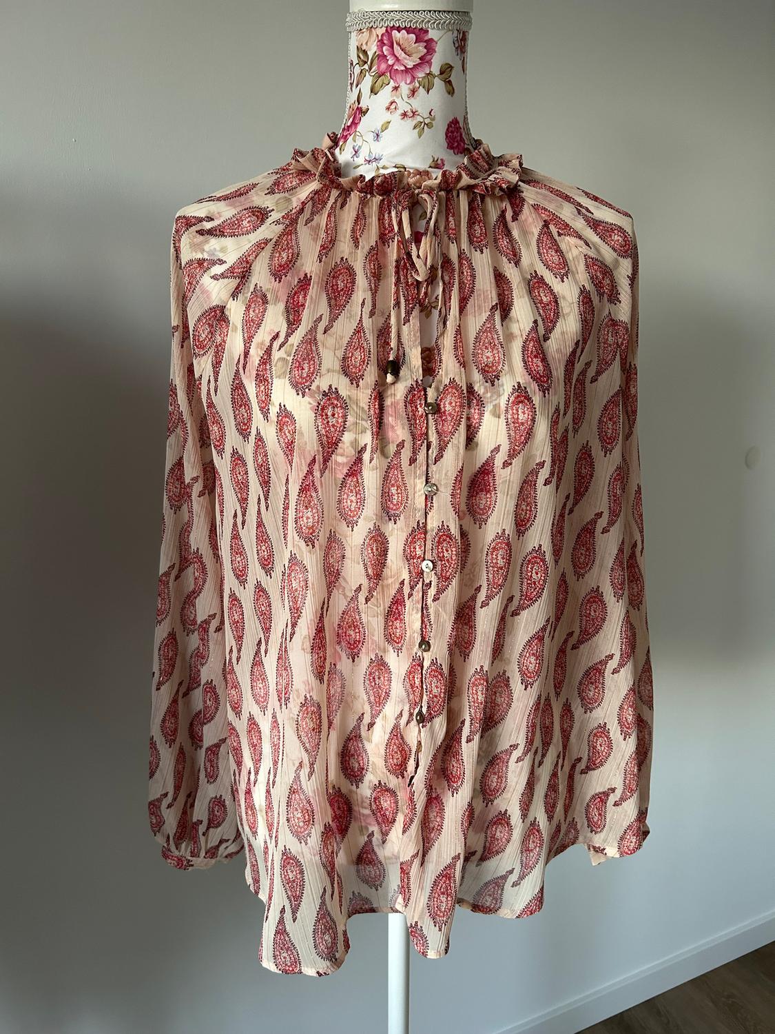 Red and beige floral print chiffon blouse, displayed on a mannequin with a flower-decorated neckline.