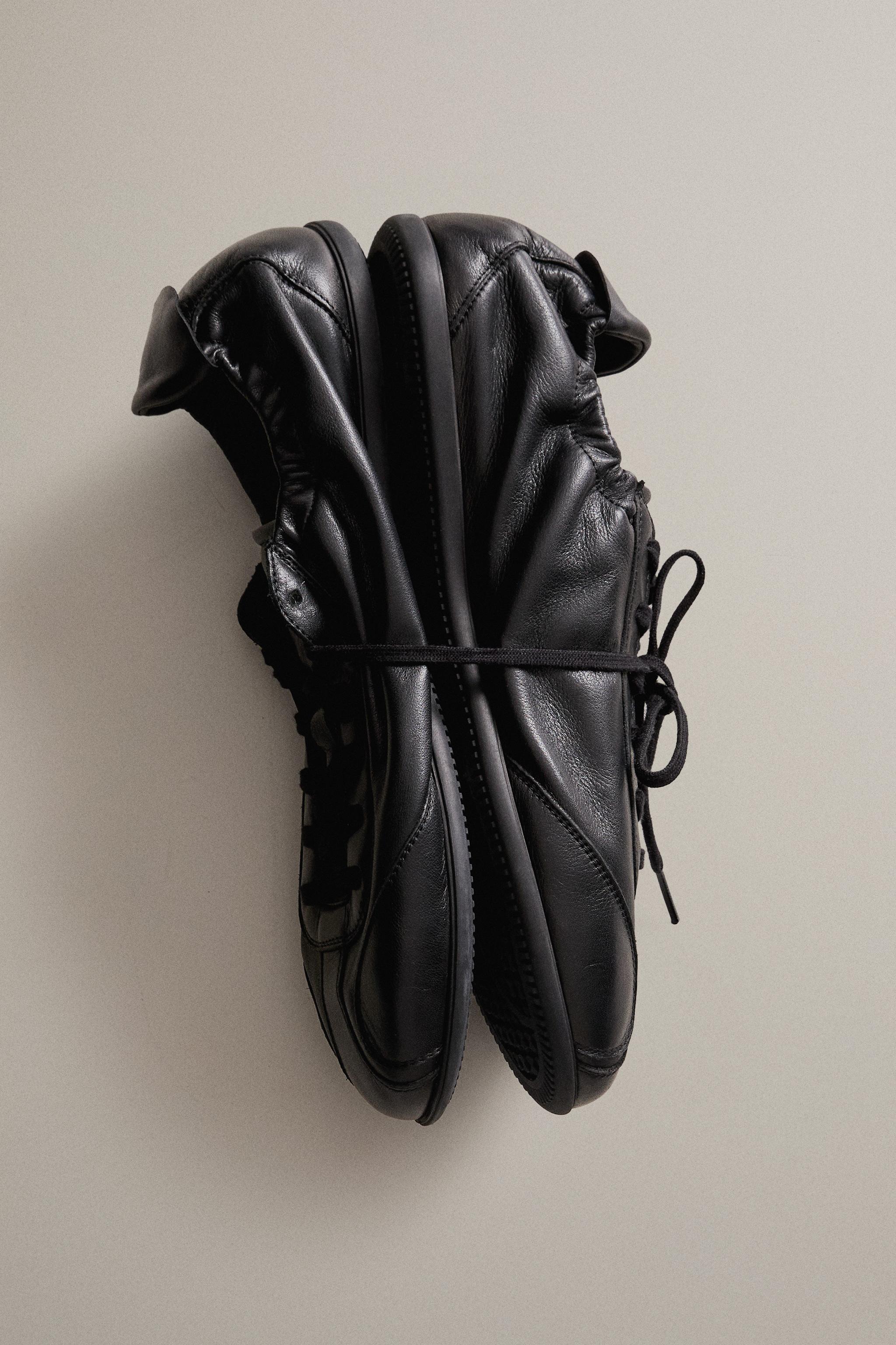 CHAUSSONS TENNIS EN CUIR