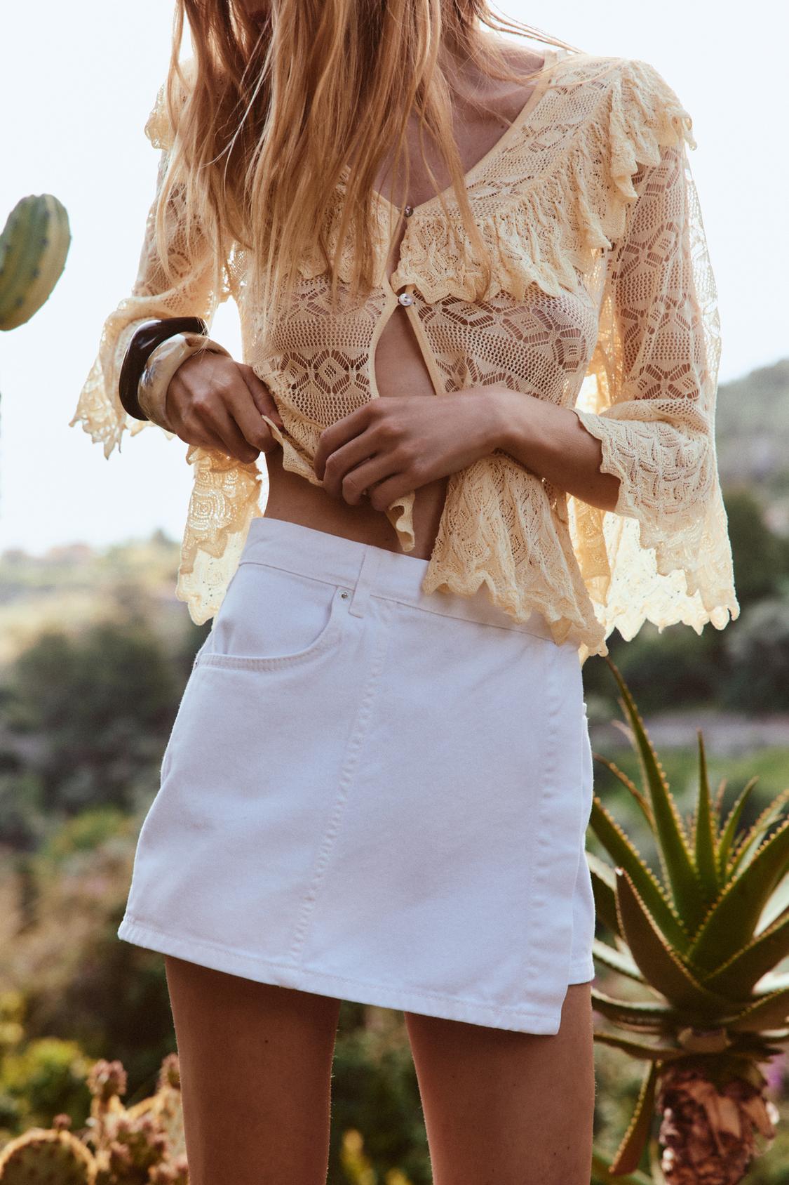 POINTELLE KNIT RUFFLED BLOUSE