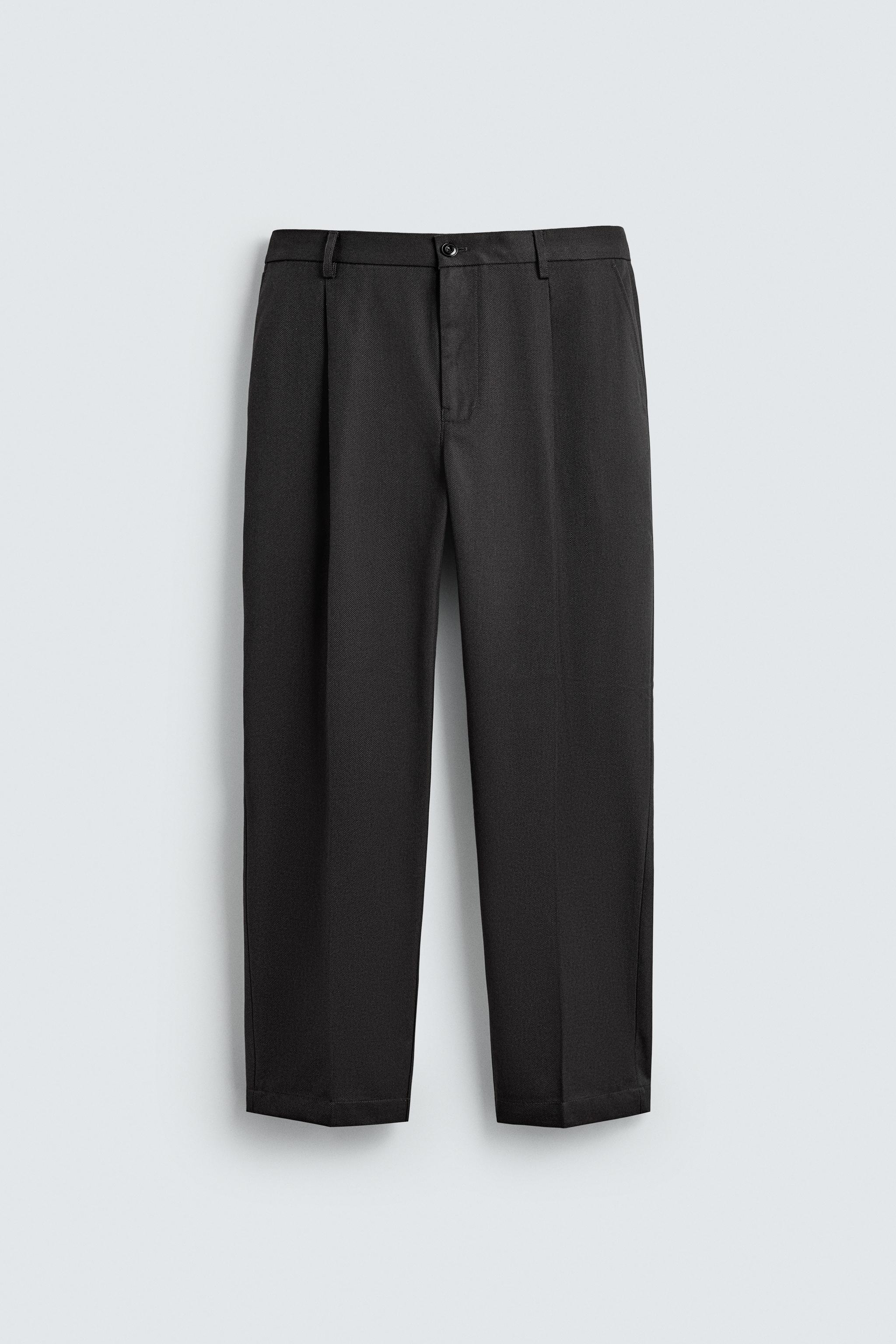 TEXTURED PLEATED PANTS