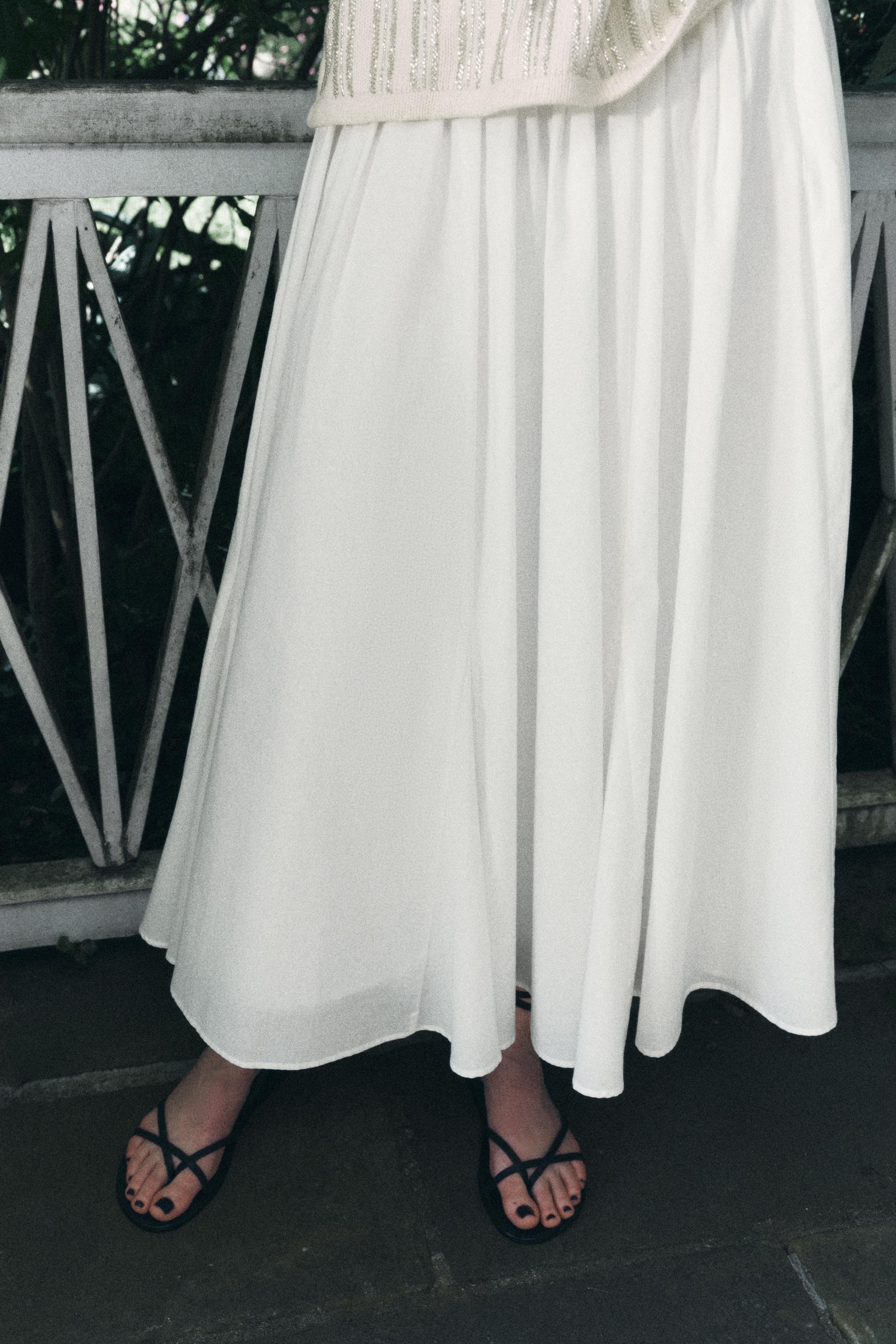 Mid length white skirts hotsell