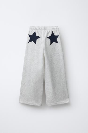 PANTALON EN MOLLETON À JAMBES LARGES ÉTOILES - Gris chiné de Zara - Image 1