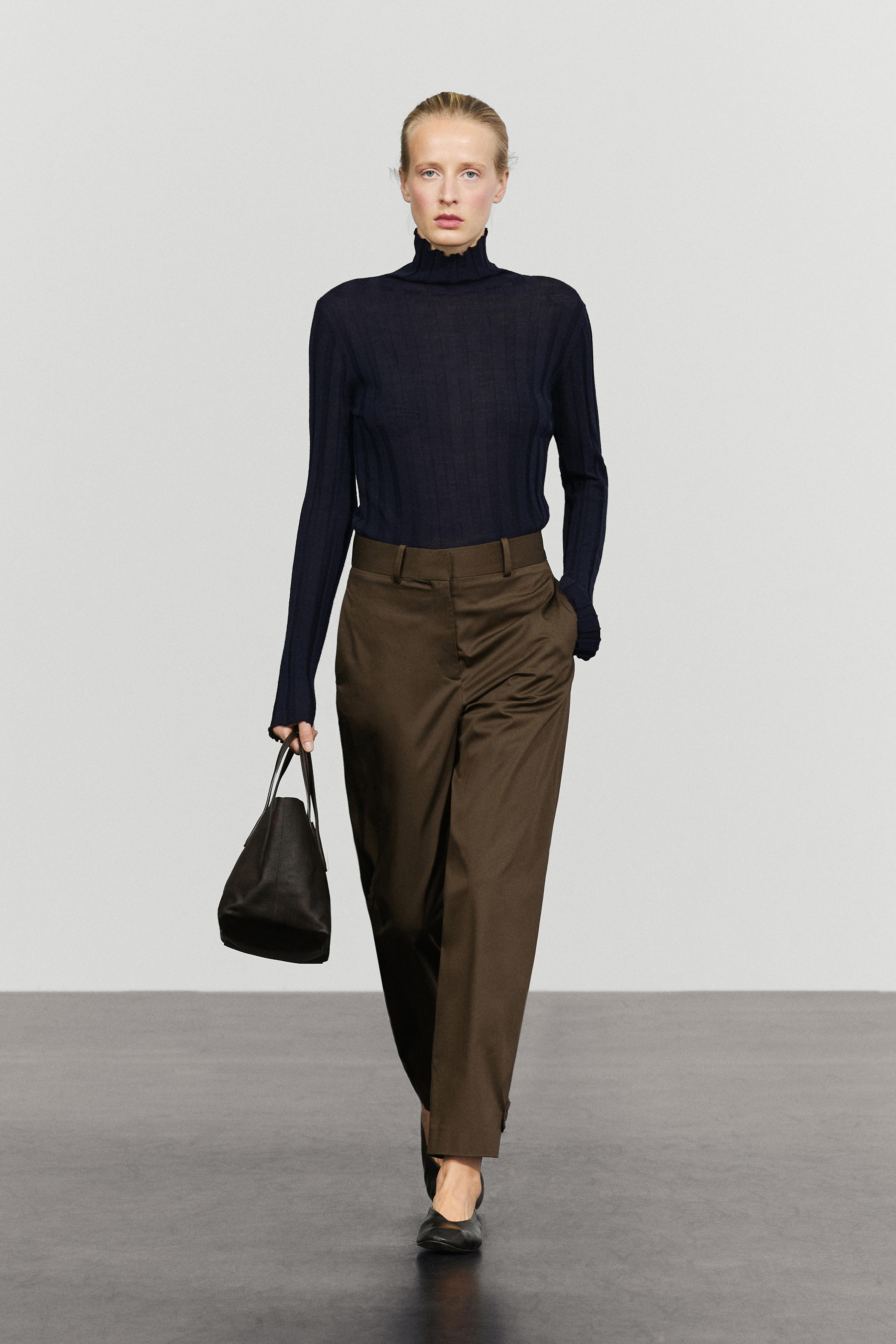 Pants with button-tab hem detail