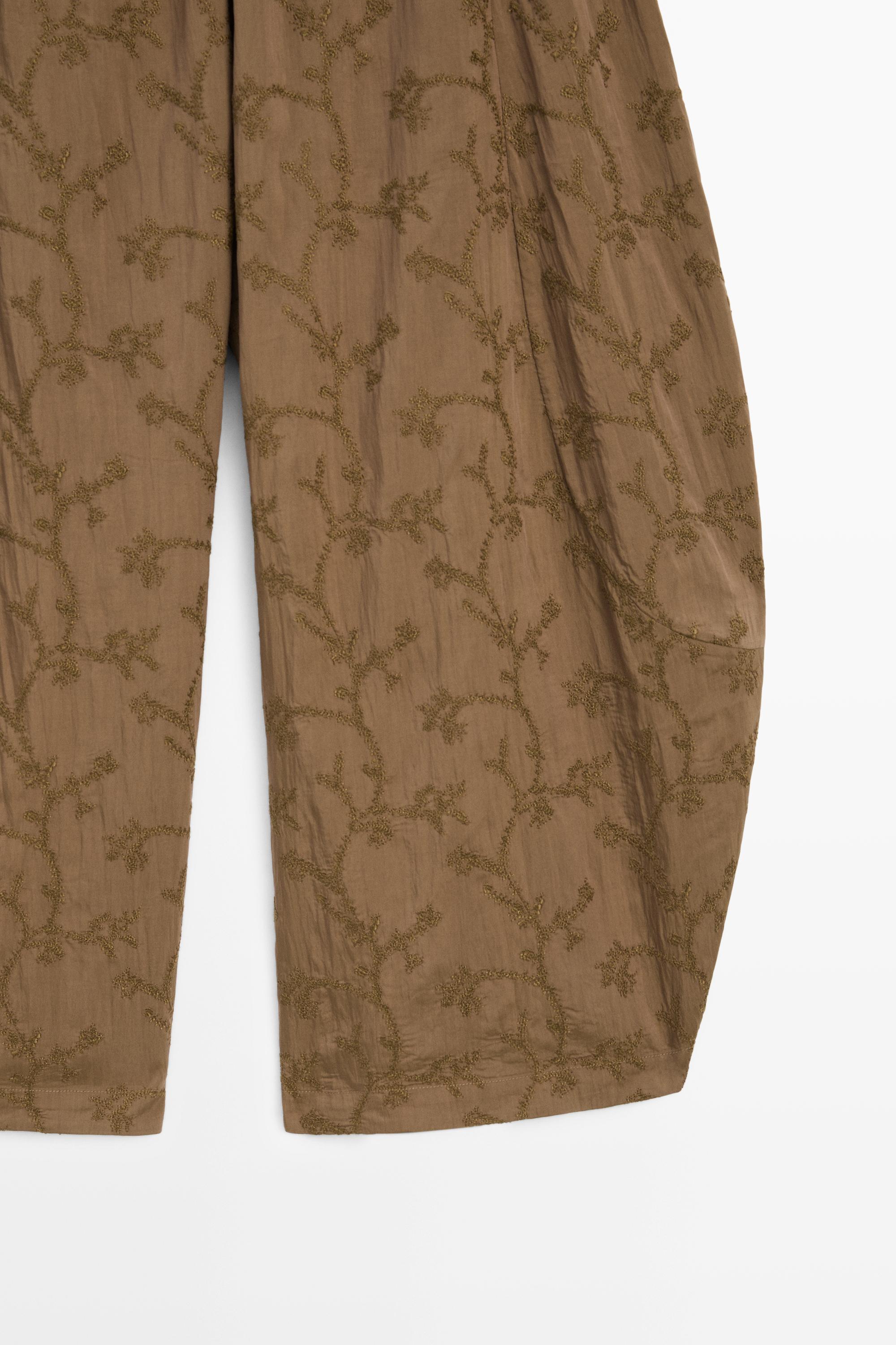 Trousers with embroidered detail and elastic waistband