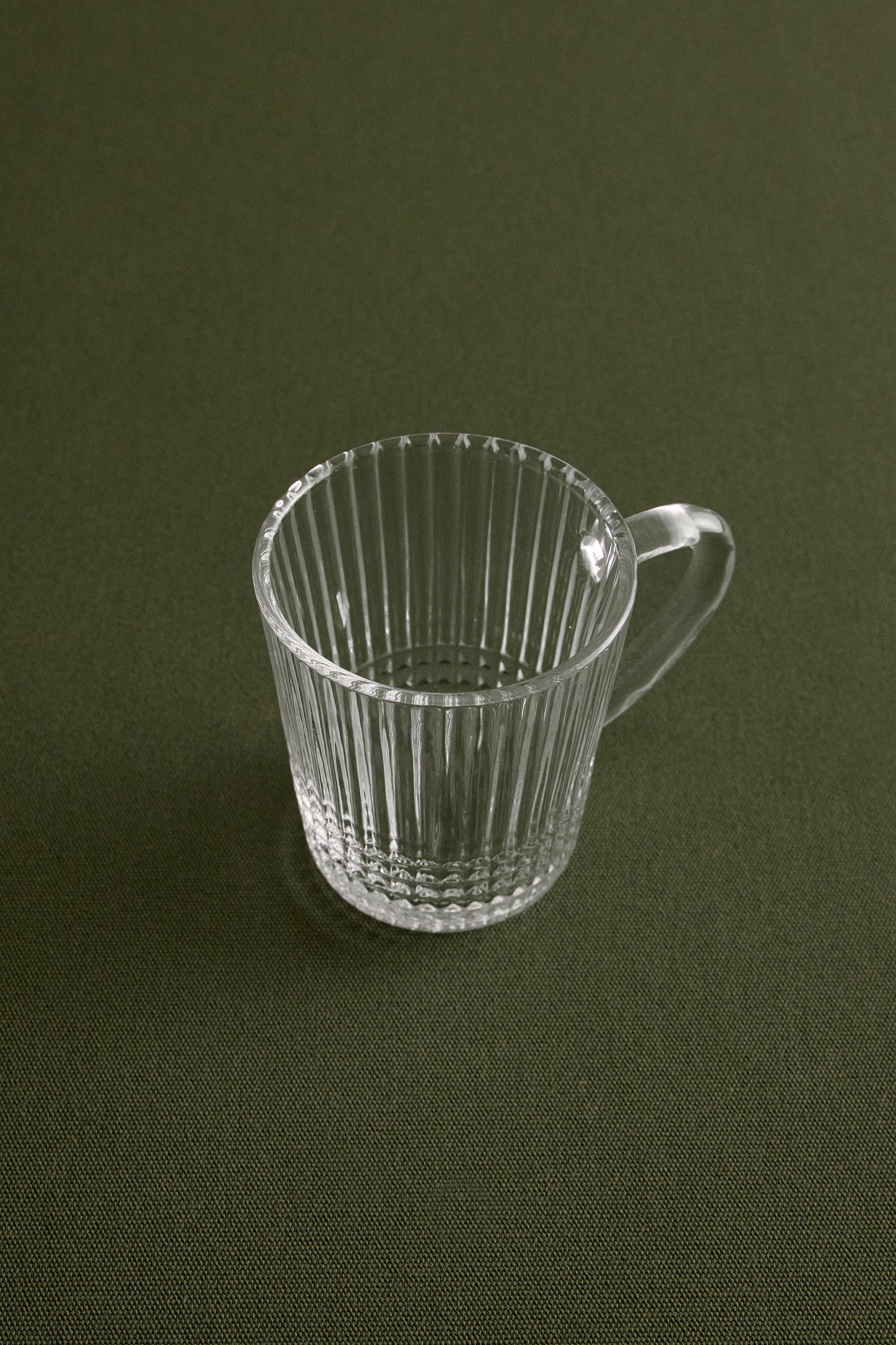 GLASS MUG WITH A RAISED GEOMETRIC DESIGN