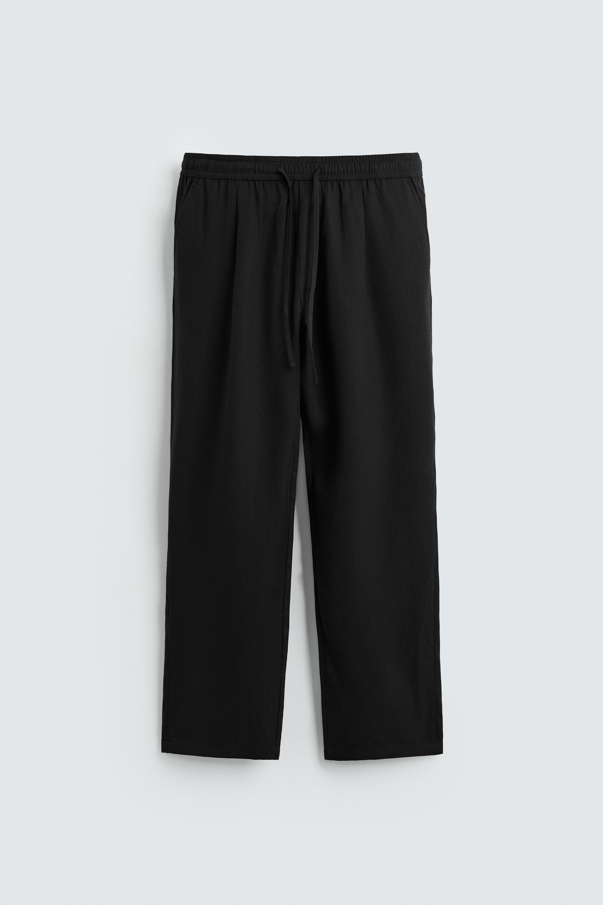 RELAXED FIT FLOWY PANTS