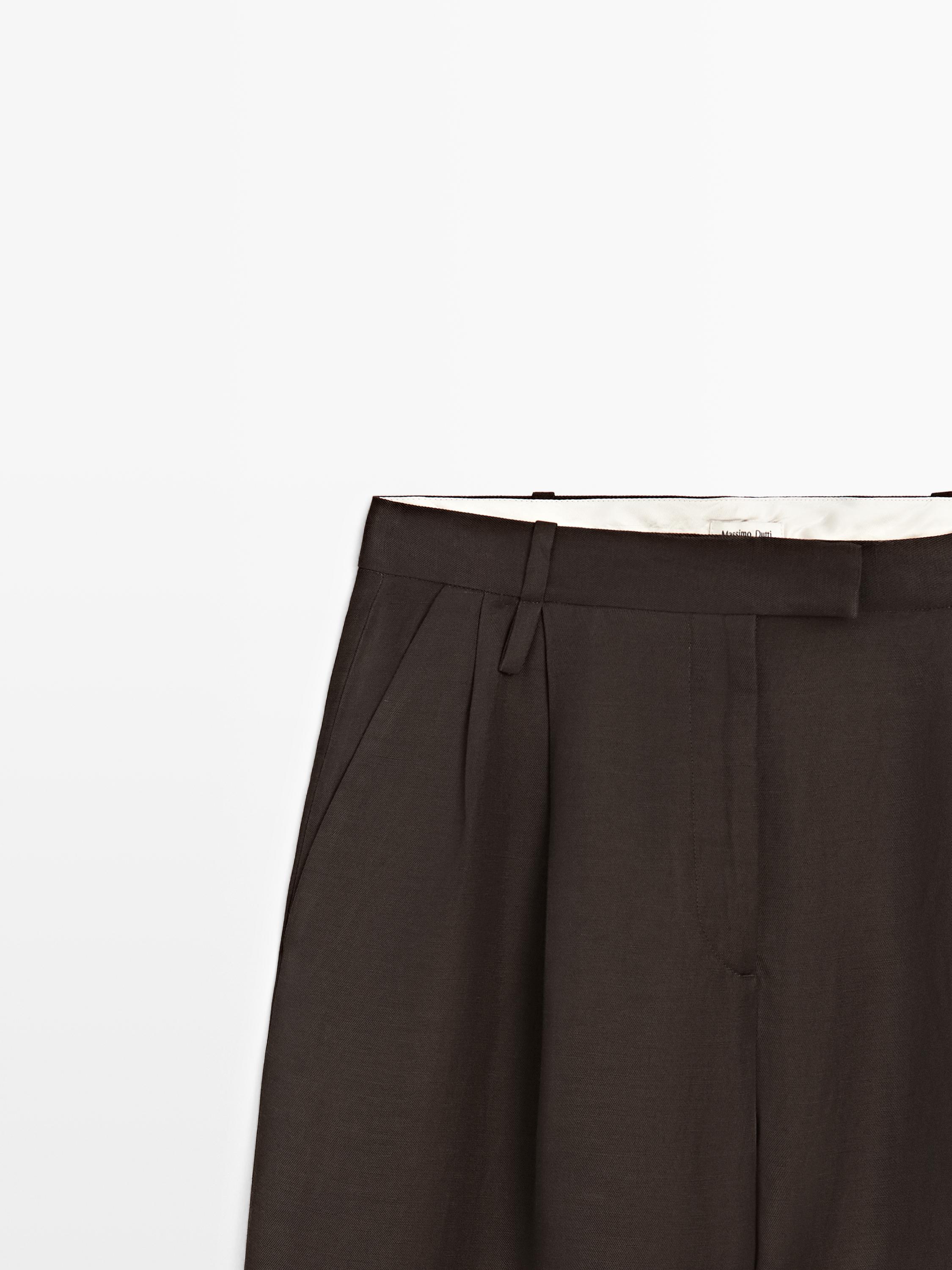 Pantalon à pinces avec passants - STUDIO