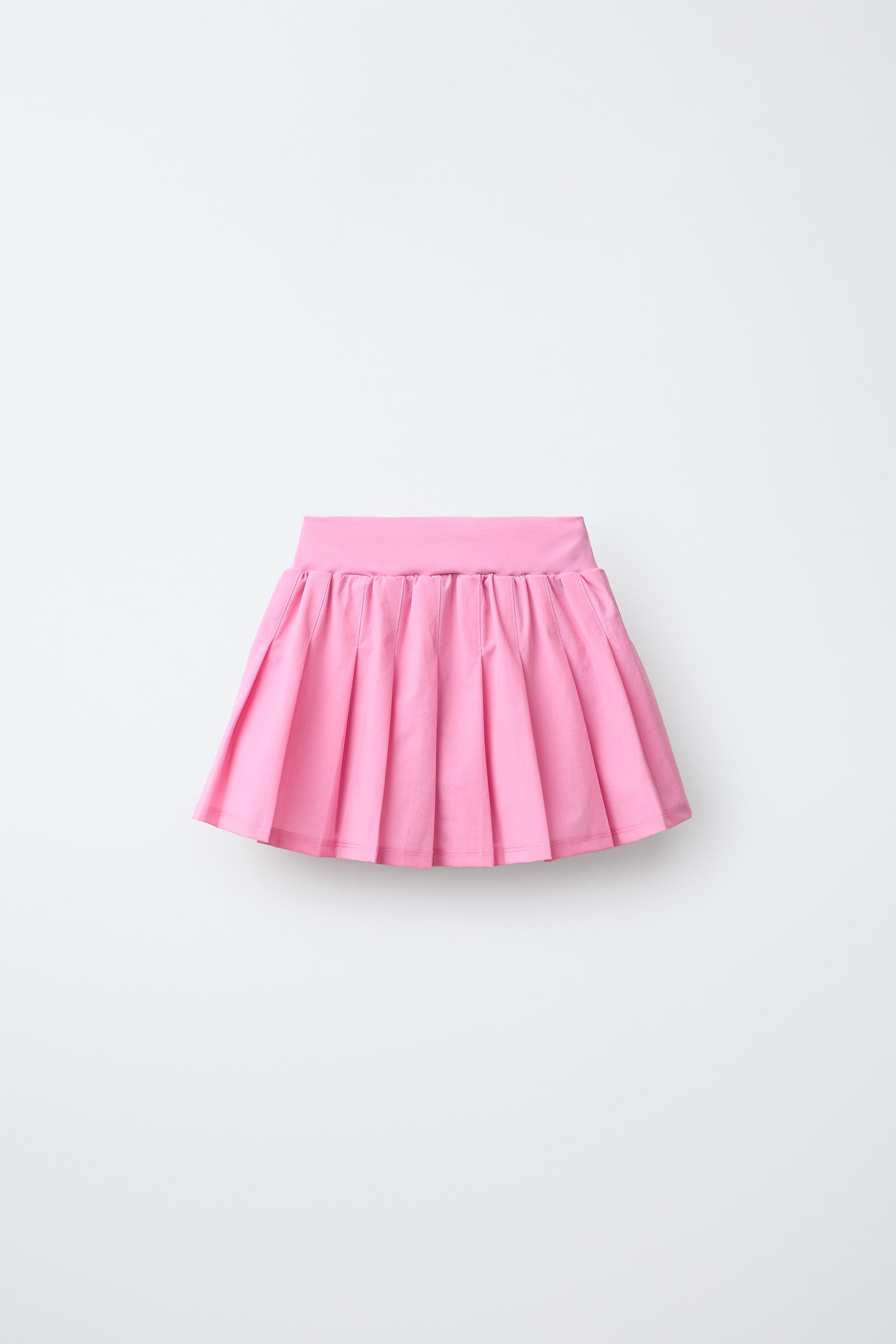 PLEATED BIKE SHORT SKIRT — Chalk pink