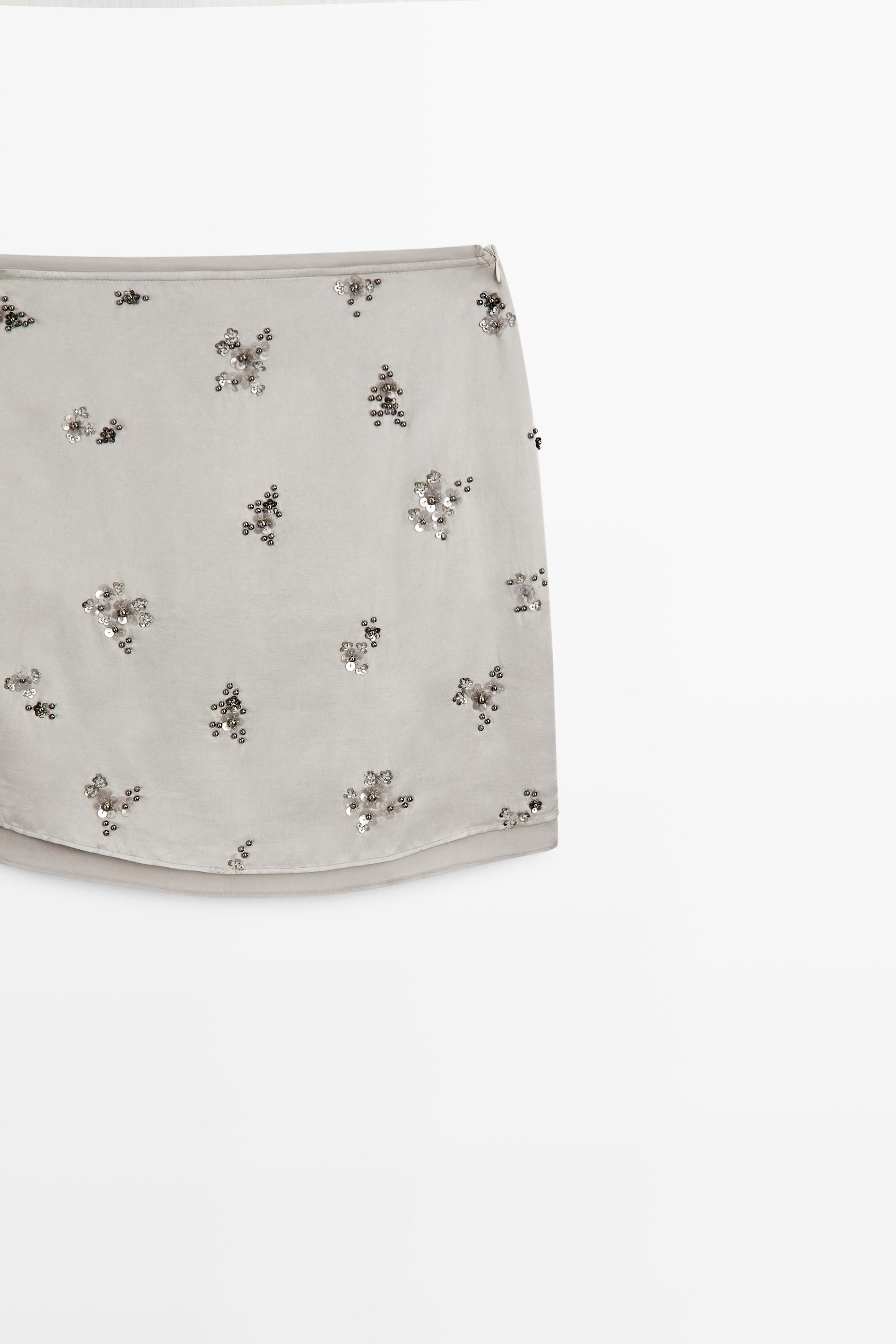 Mini skirt with beaded detail