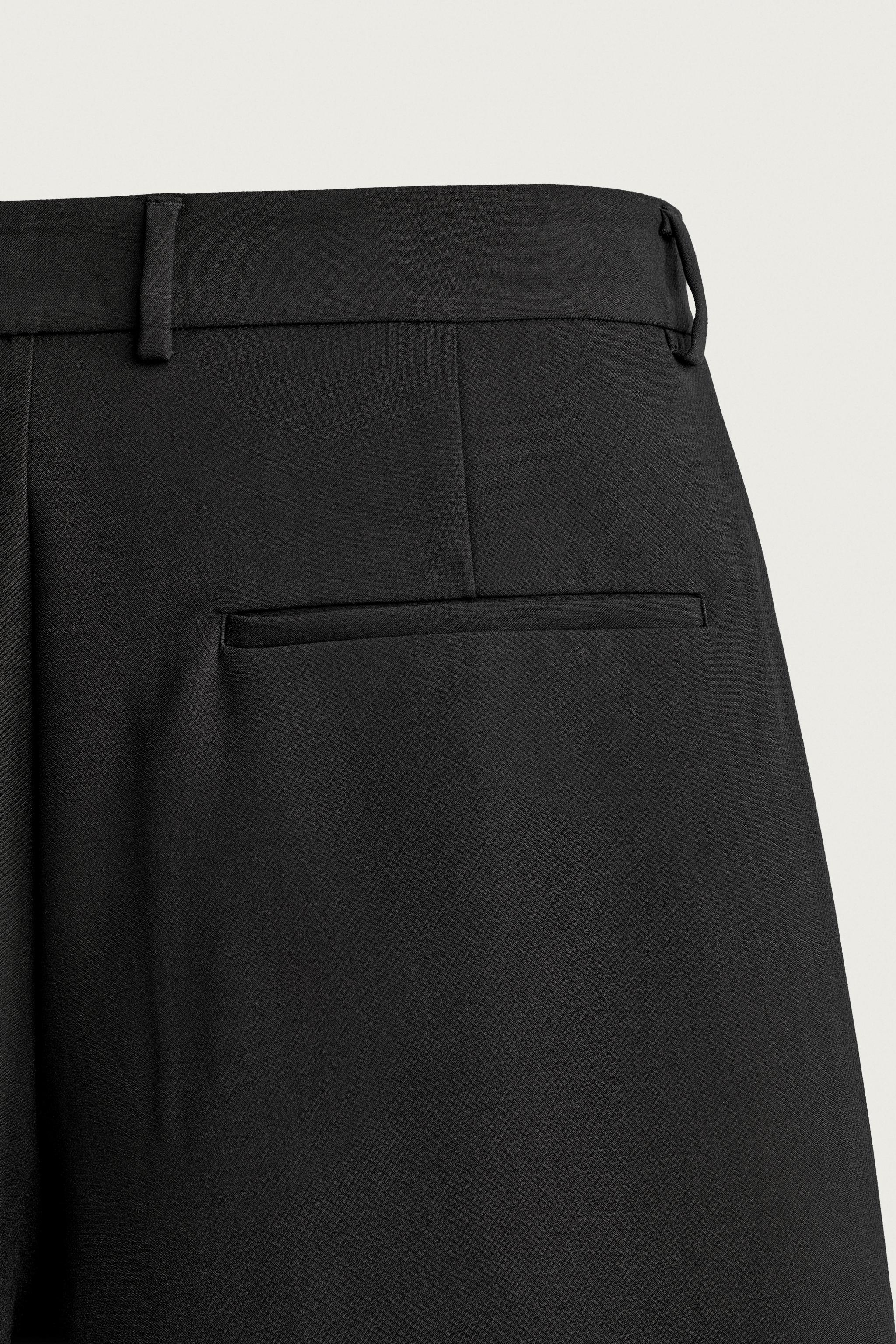RELAXED FIT PLEATED PANTS