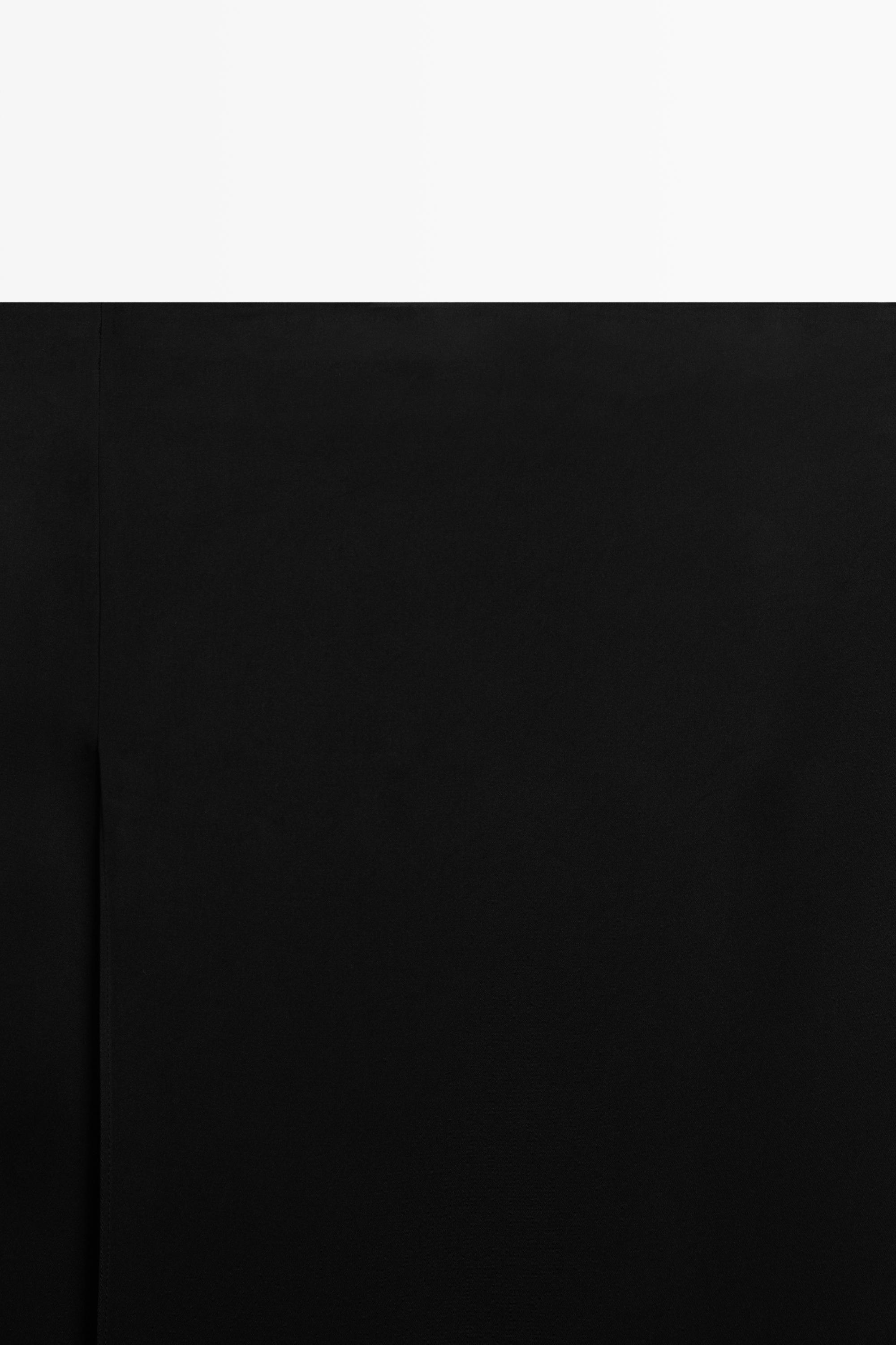 Jupe midi droite double coupe semi-transparente