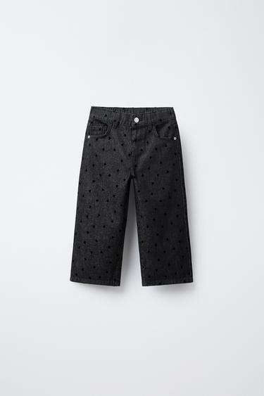 JEANS WIDE LEG CORAZONES FLOCK - أسود الخاص بـ Zara