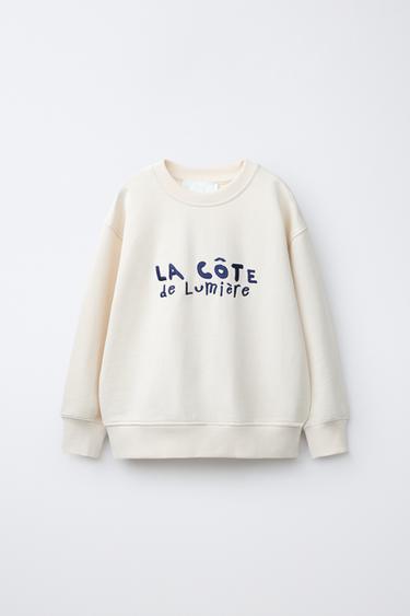 ТОЛСТОВКА С ВЫШИТОЙ НАДПИСЬЮ — СЛОНОВАЯ КОСТЬ от Zara