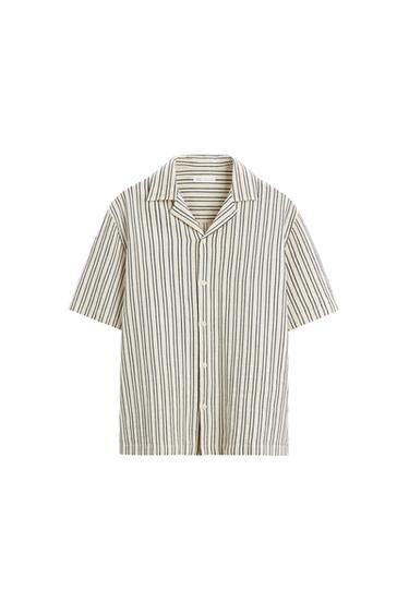 Front view of a vertically striped shirt with an open collar and front buttons.