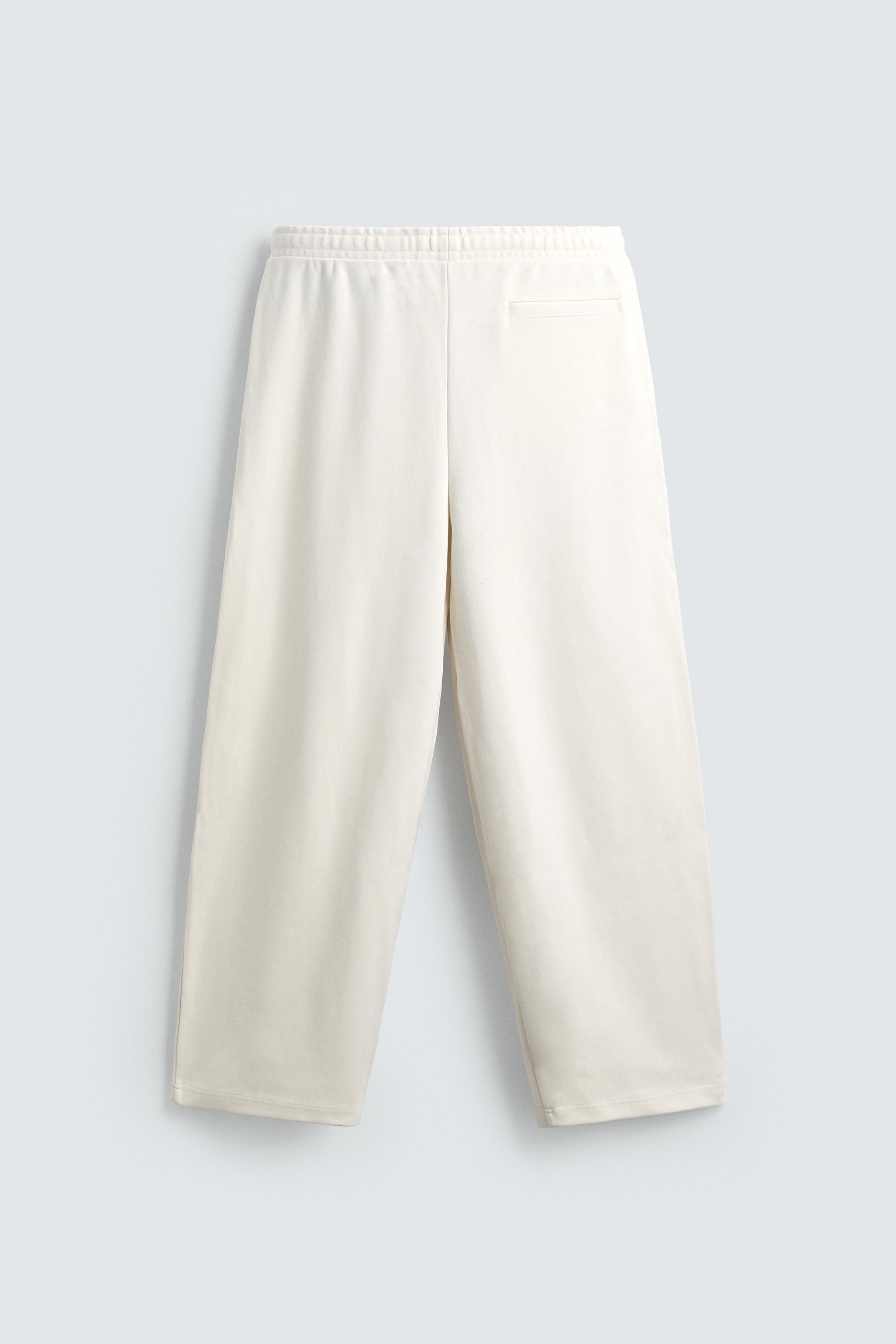 PLEATED WIDE FIT JOGGER PANTS