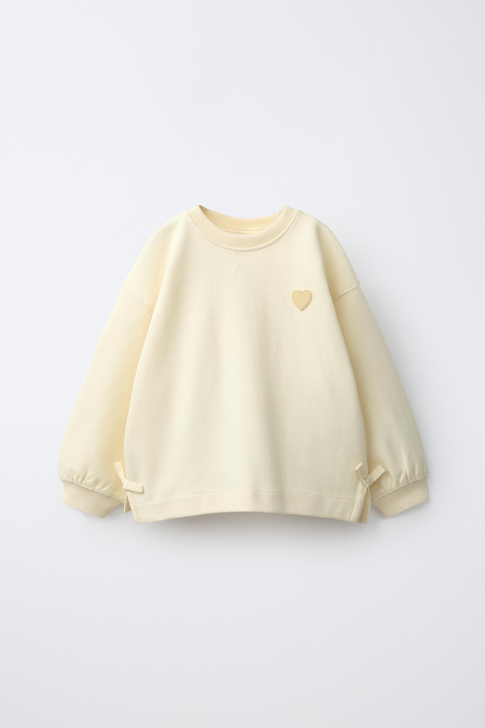 INTERLOCK BOW AND HEART SWEATSHIRT