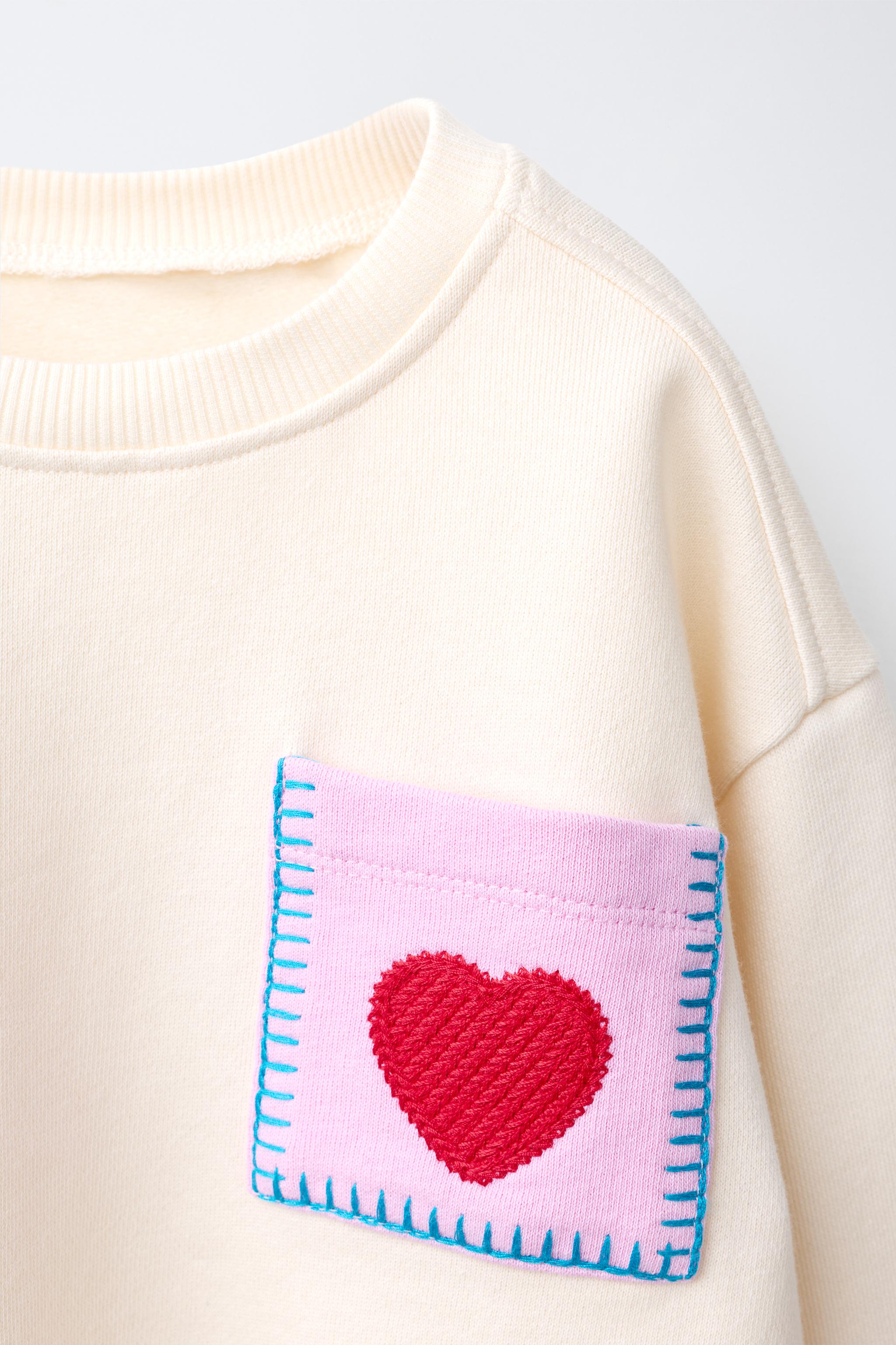 HEART POCKET SWEATSHIRT