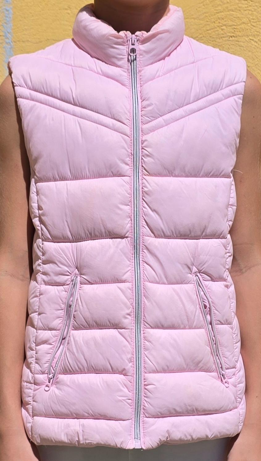 Light pink padded gilet with front zip and pockets, on a yellow background. Torso model visible.