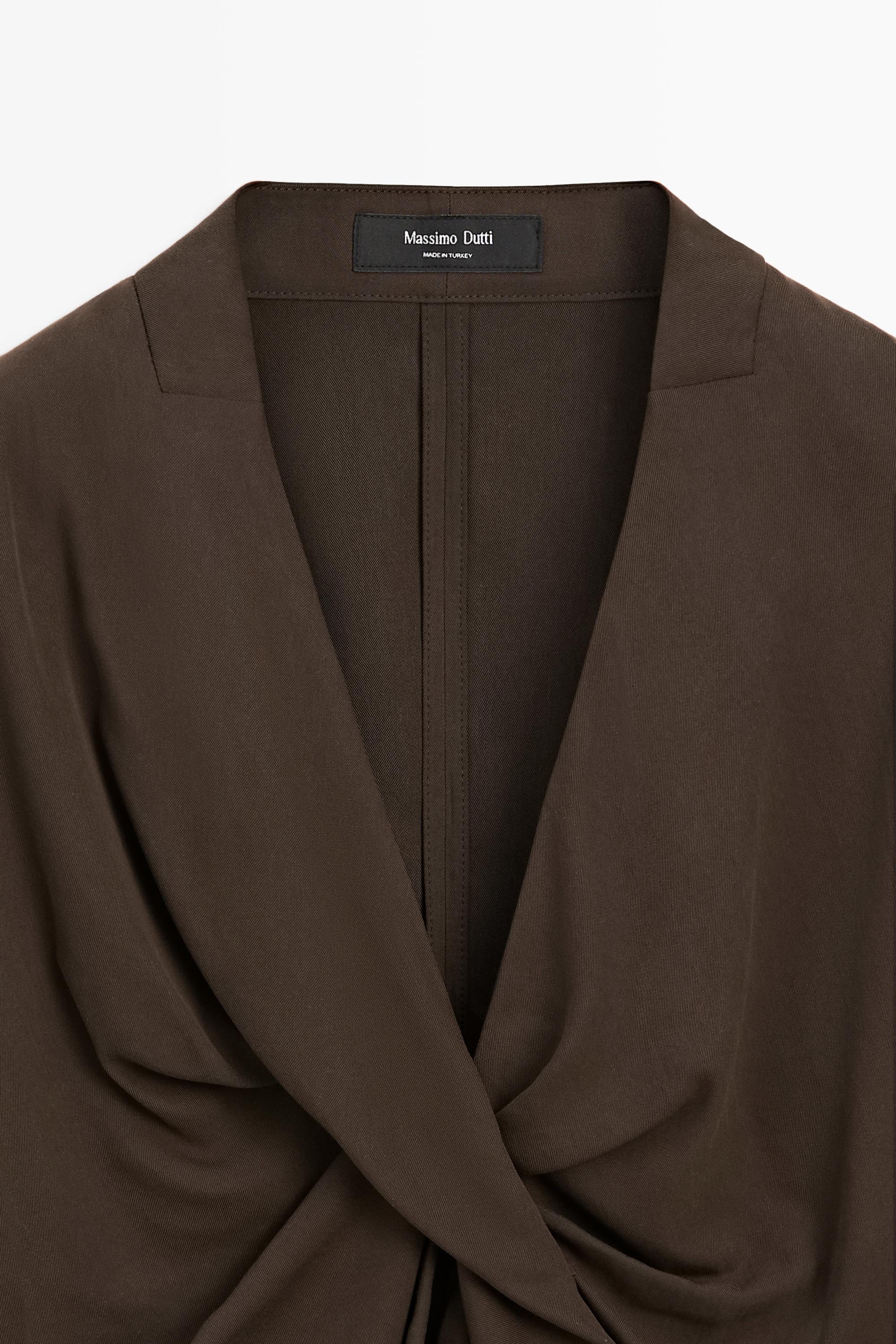 Flowing blouse with draped detail