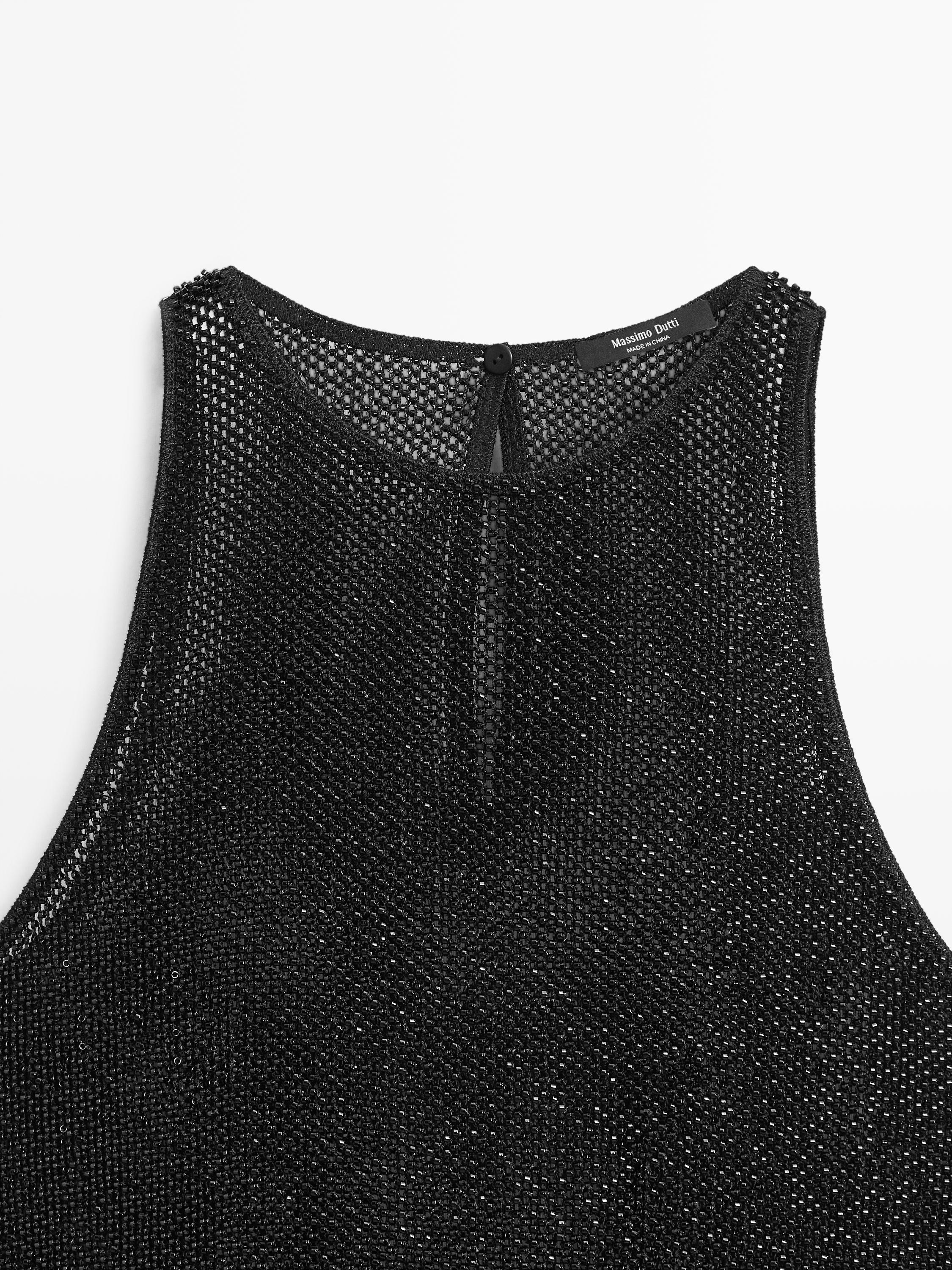 Semi-sheer top with matching beads