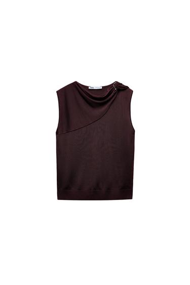 Front view of a burgundy sleeveless top with a shoulder pleat detail.