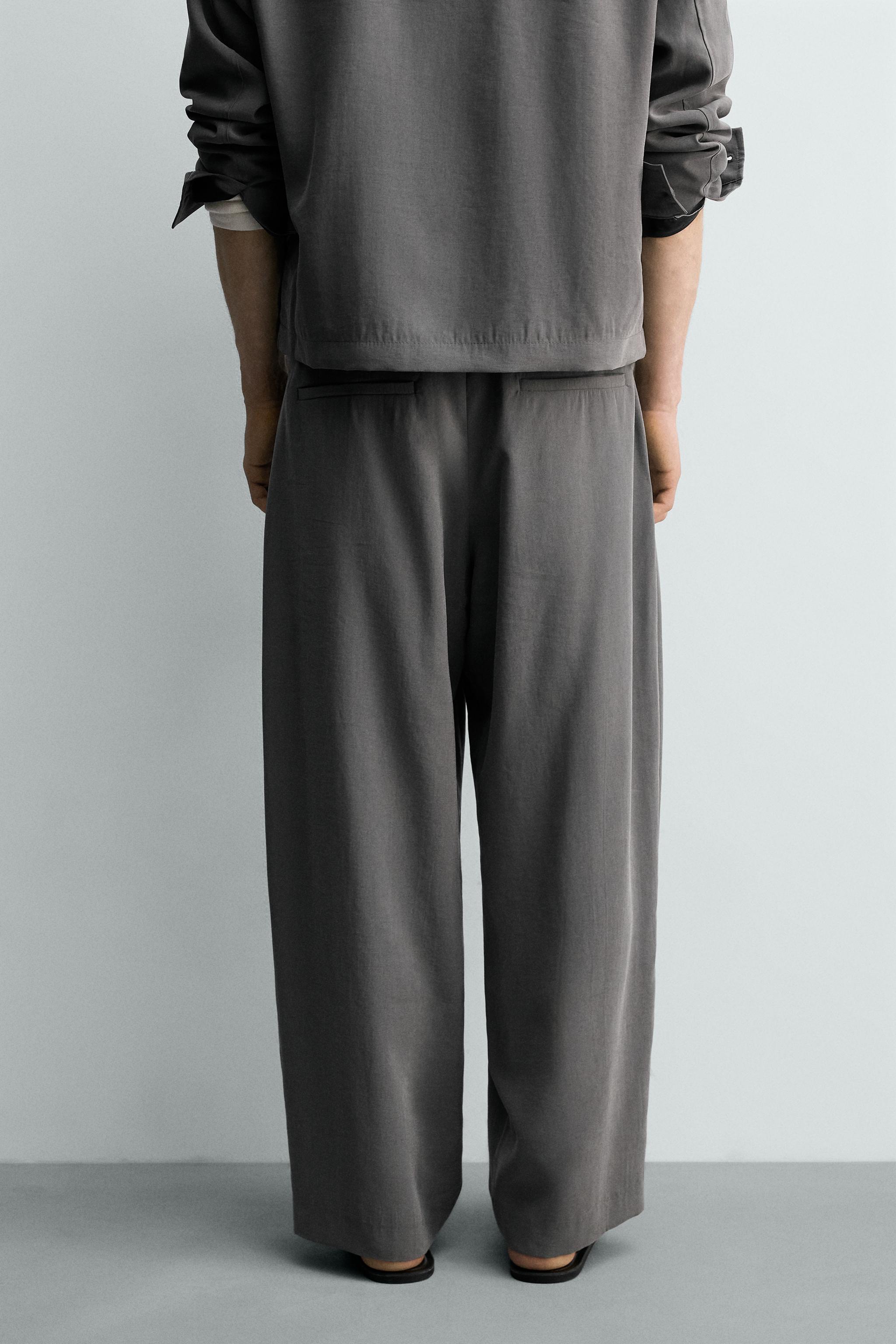 FLOWY PLEATED PANTS