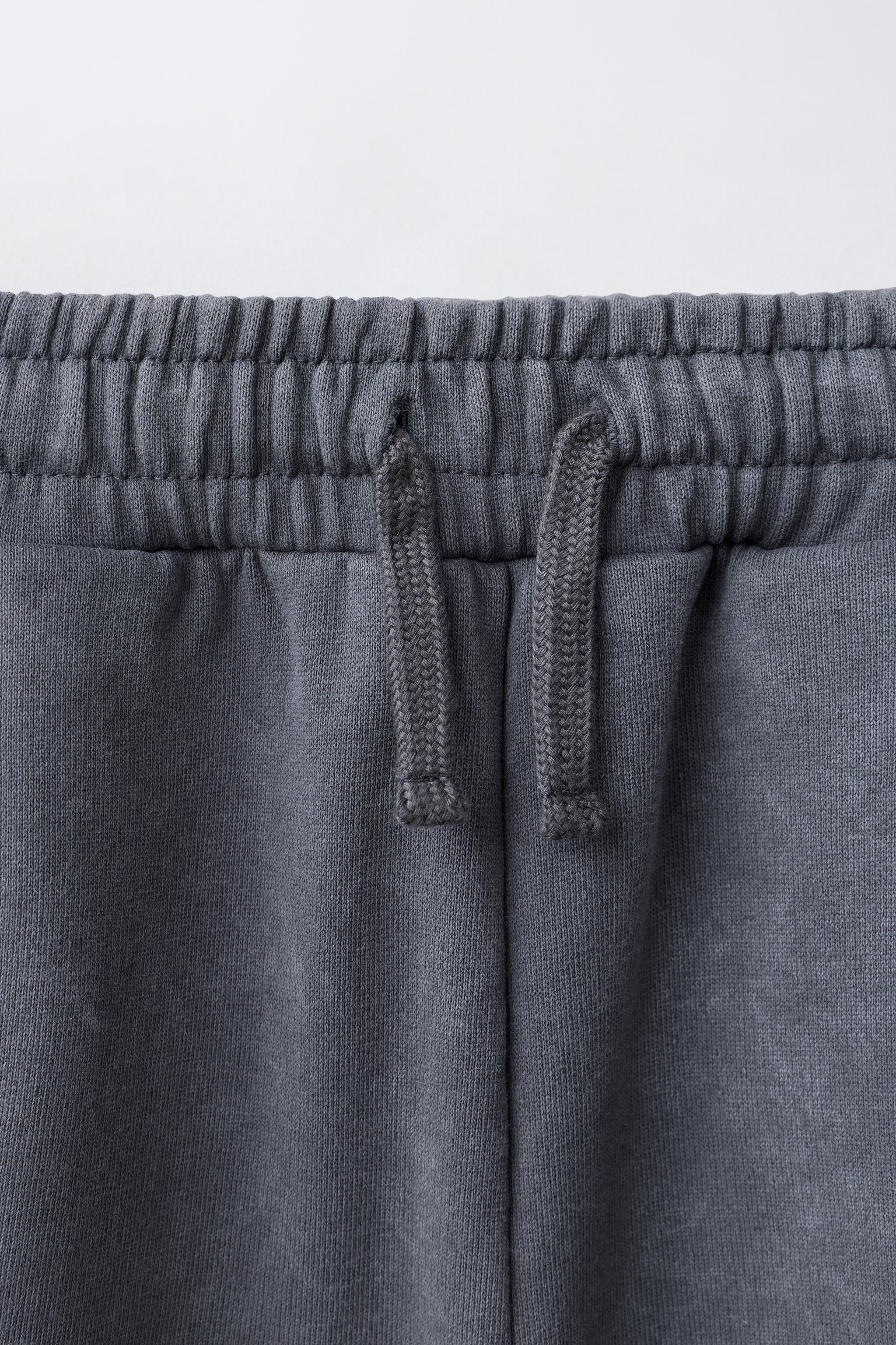 SHORT LONG À INSCRIPTIONS