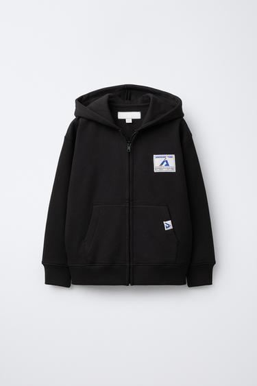 CHAQUETA JOGGING CREMALLERA ETIQUETA  - Negro de Zara