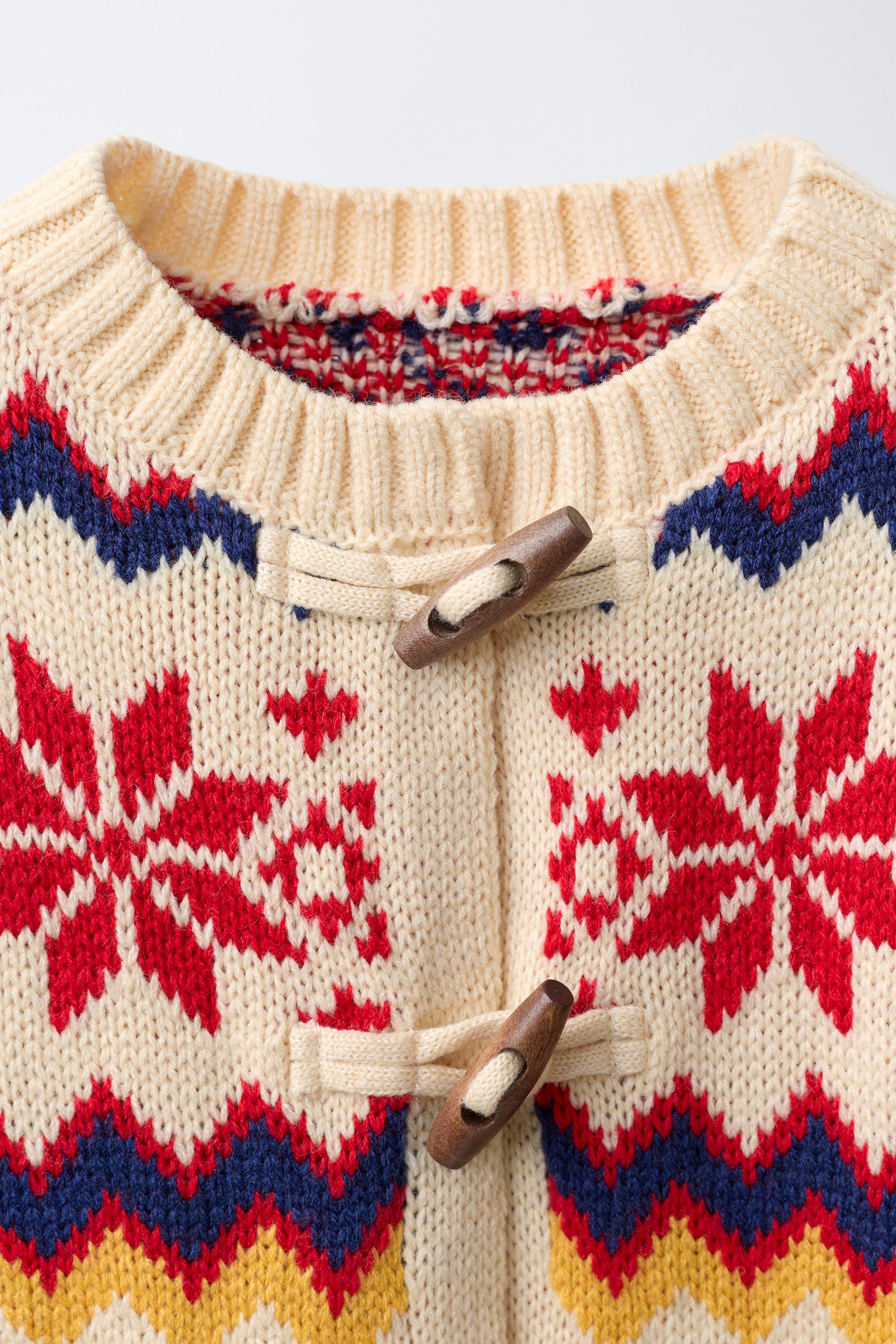 GILET EN MAILLE JACQUARD AVEC LAINE
