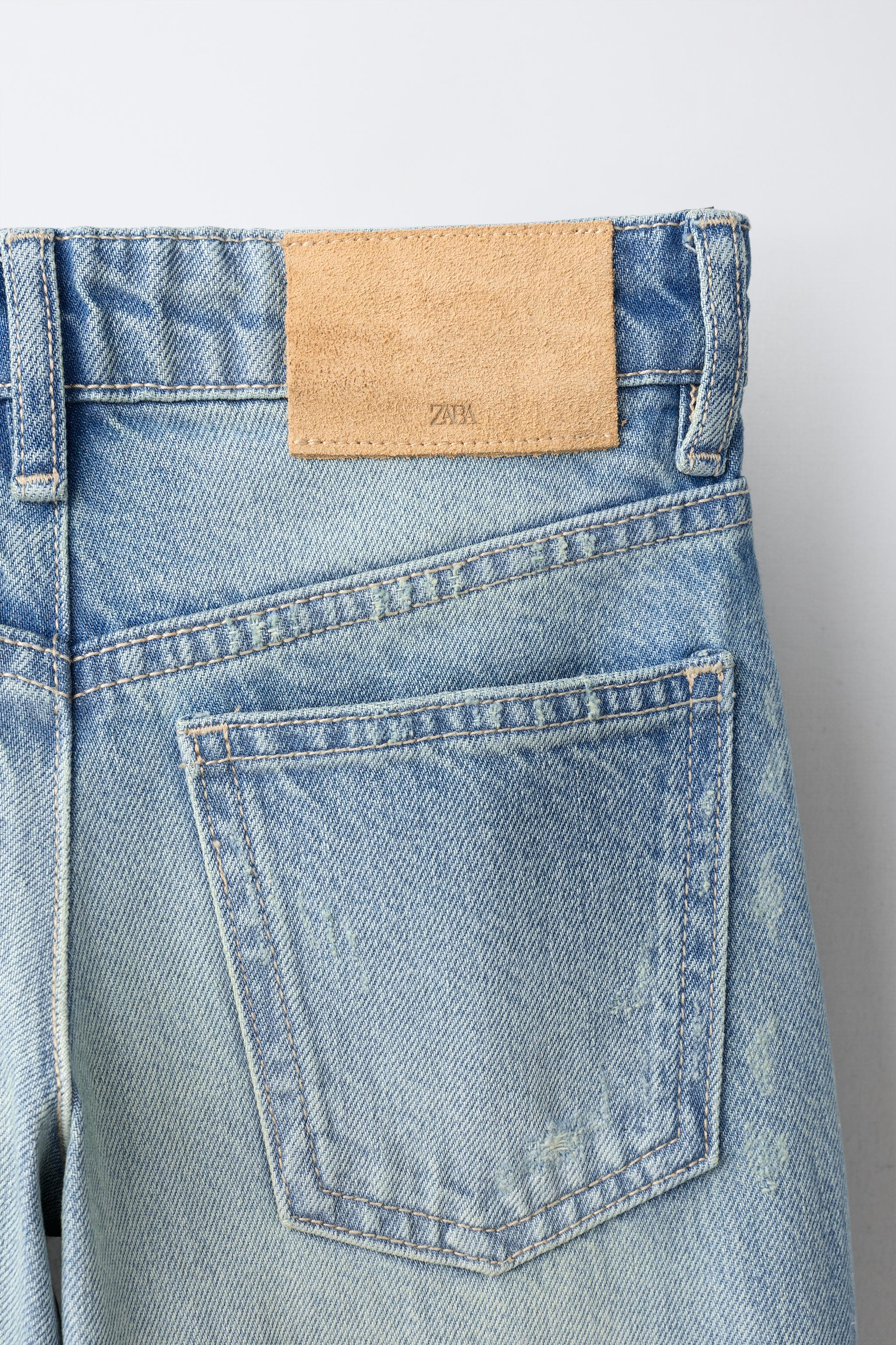 JEANS FLARE À CLOUS ET DÉCHIRURES