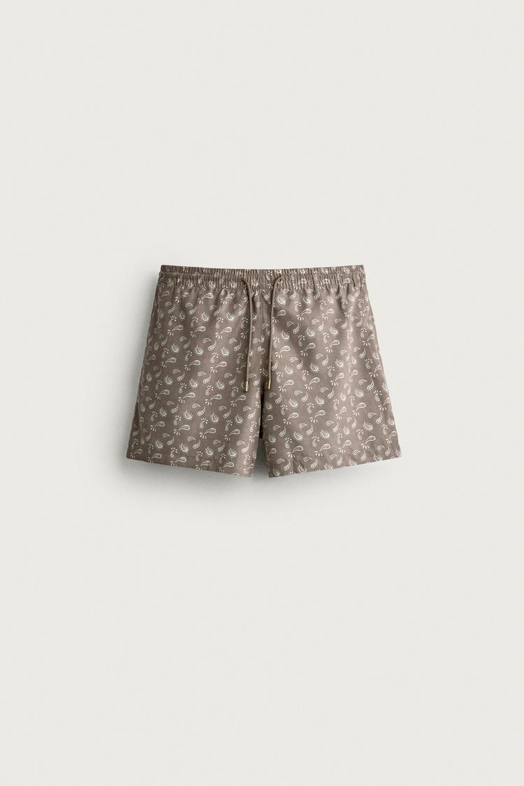 PAISLEY PRINT MID-LENGTH SWIM TRUNKS — Brown