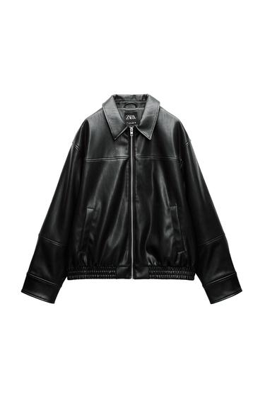 Front view of a black jacket with a zip and side pockets.