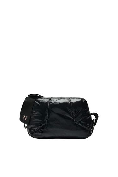 Black quilted crossbody bag with a glossy finish, wide strap, and Z-letter detail, on a white background.