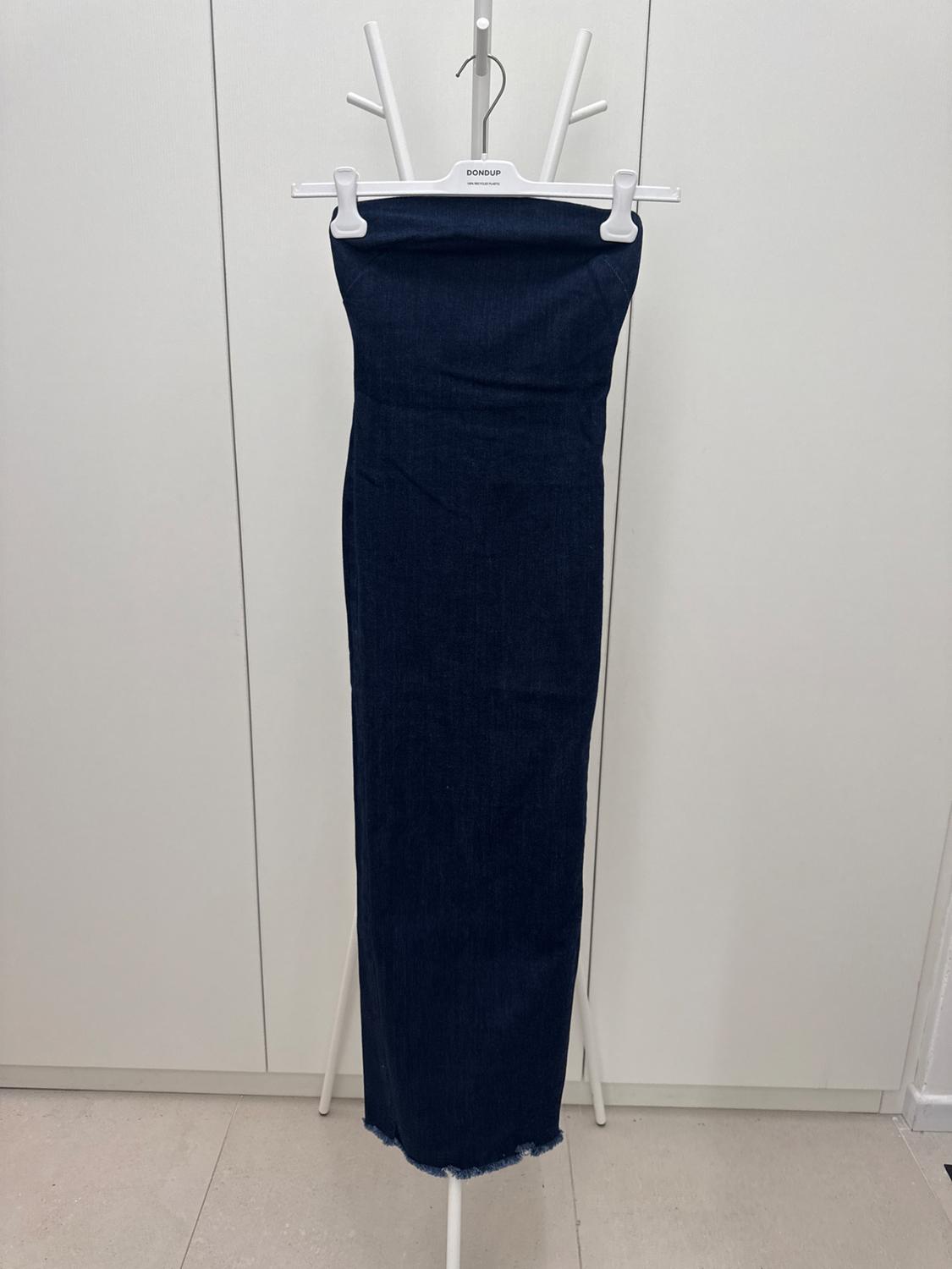 Dark blue denim maxi dress hanging on a white hanger with the text "DONDUP", on a white background.