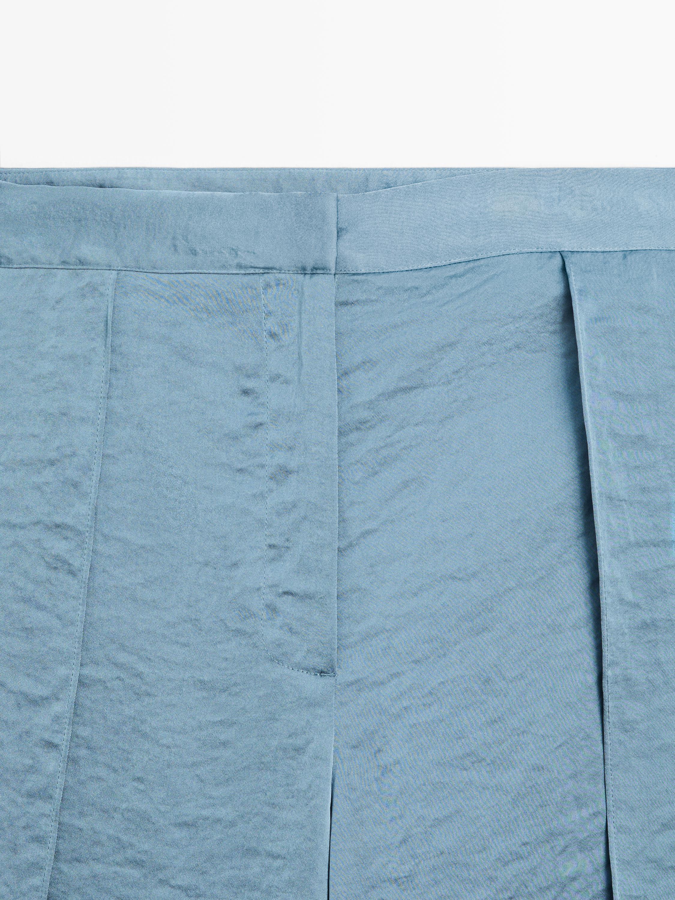 Flowing palazzo trousers with slits