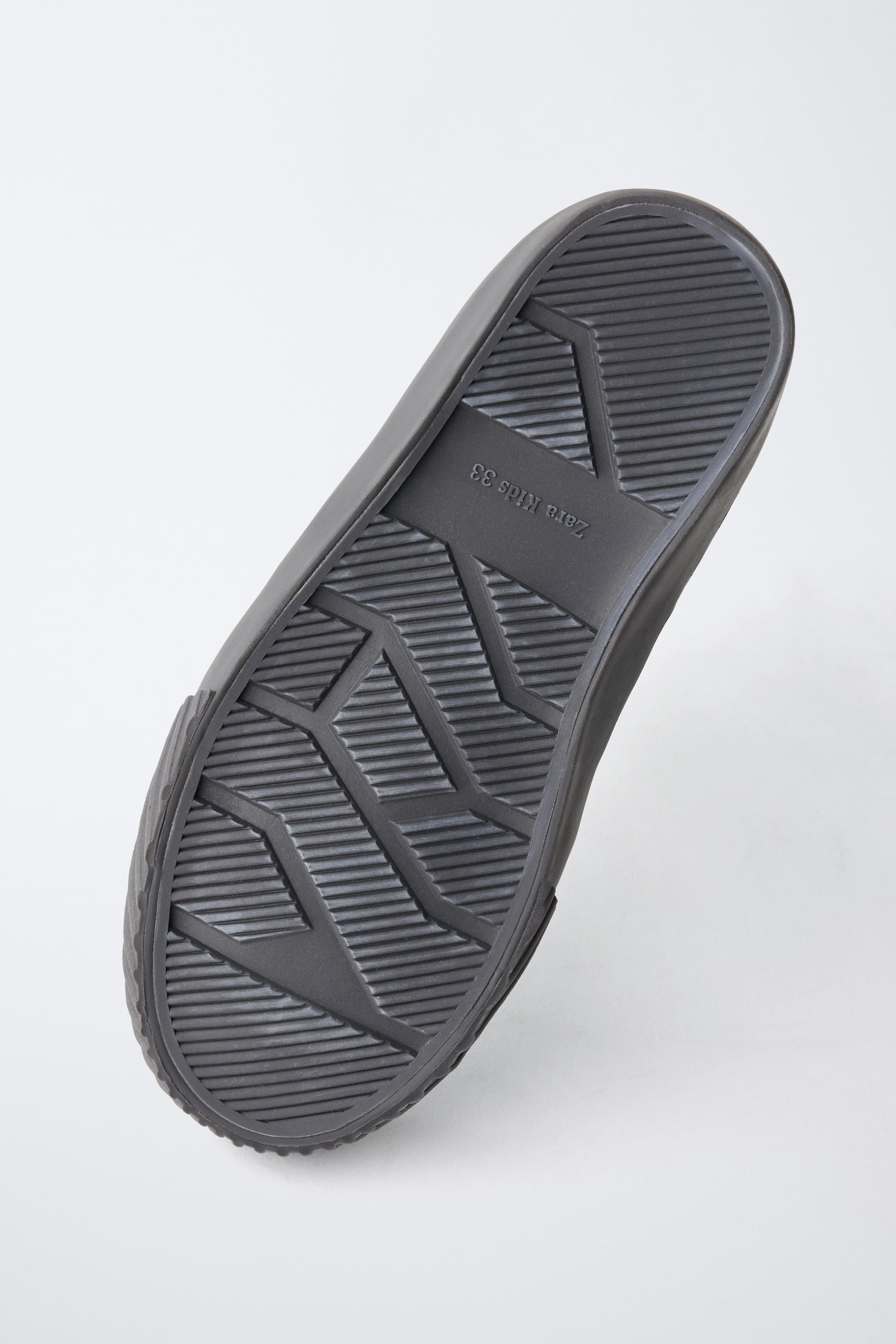 BASKETS MONTANTES EN CUIR