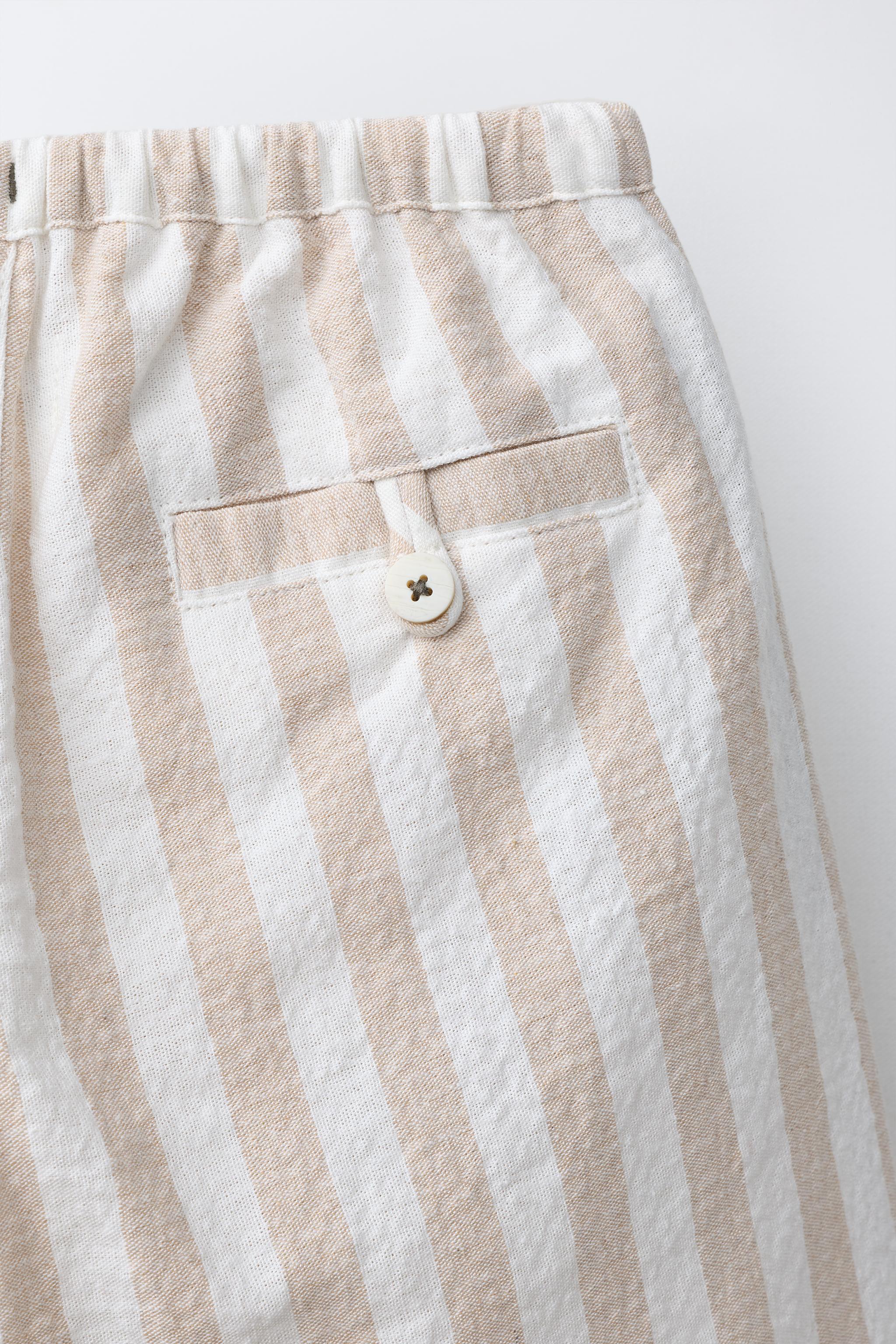 STRIPED PLEATED BALLOON PANTS