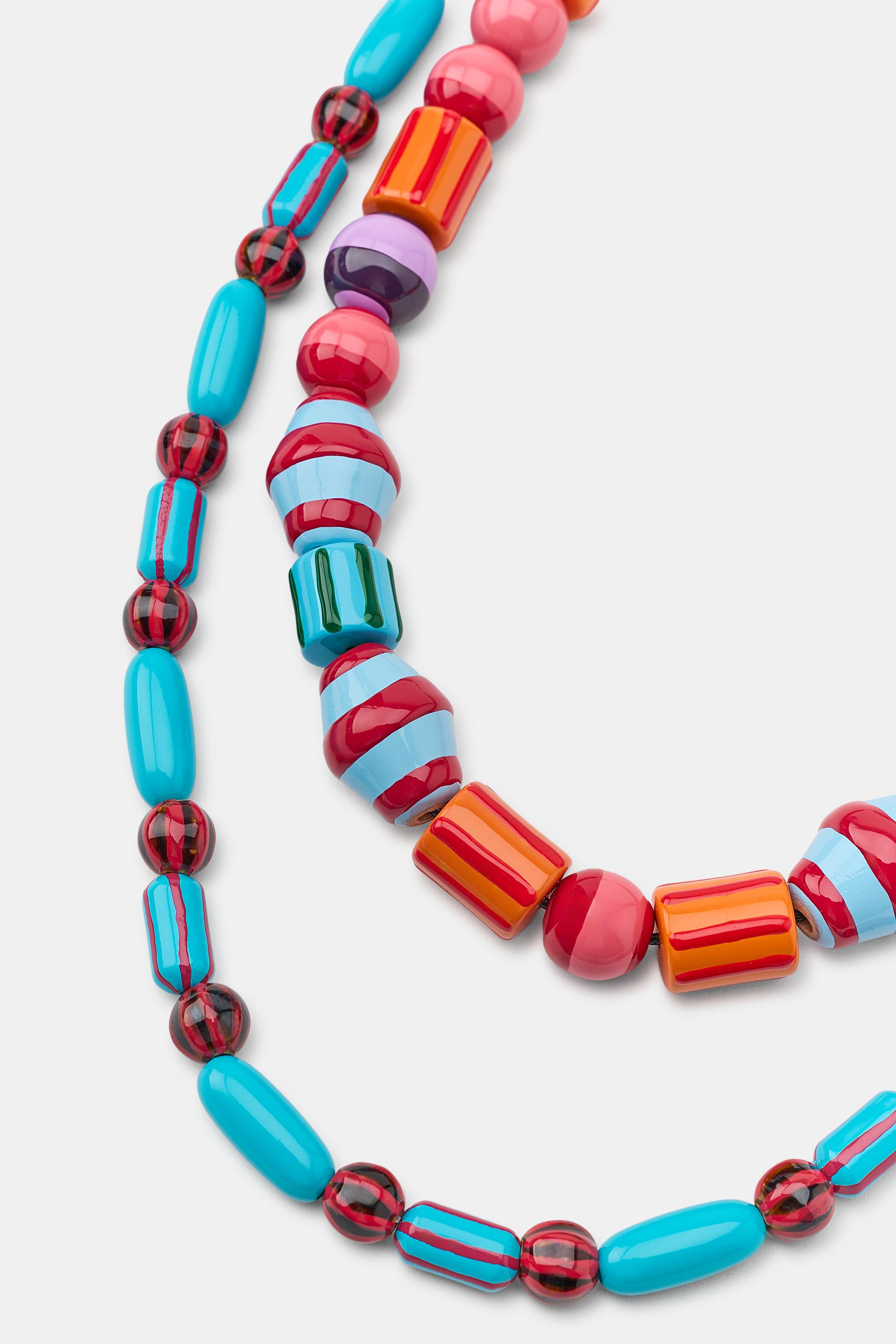 LOT DE 2 COLLIERS À BOULES ET RAYURES