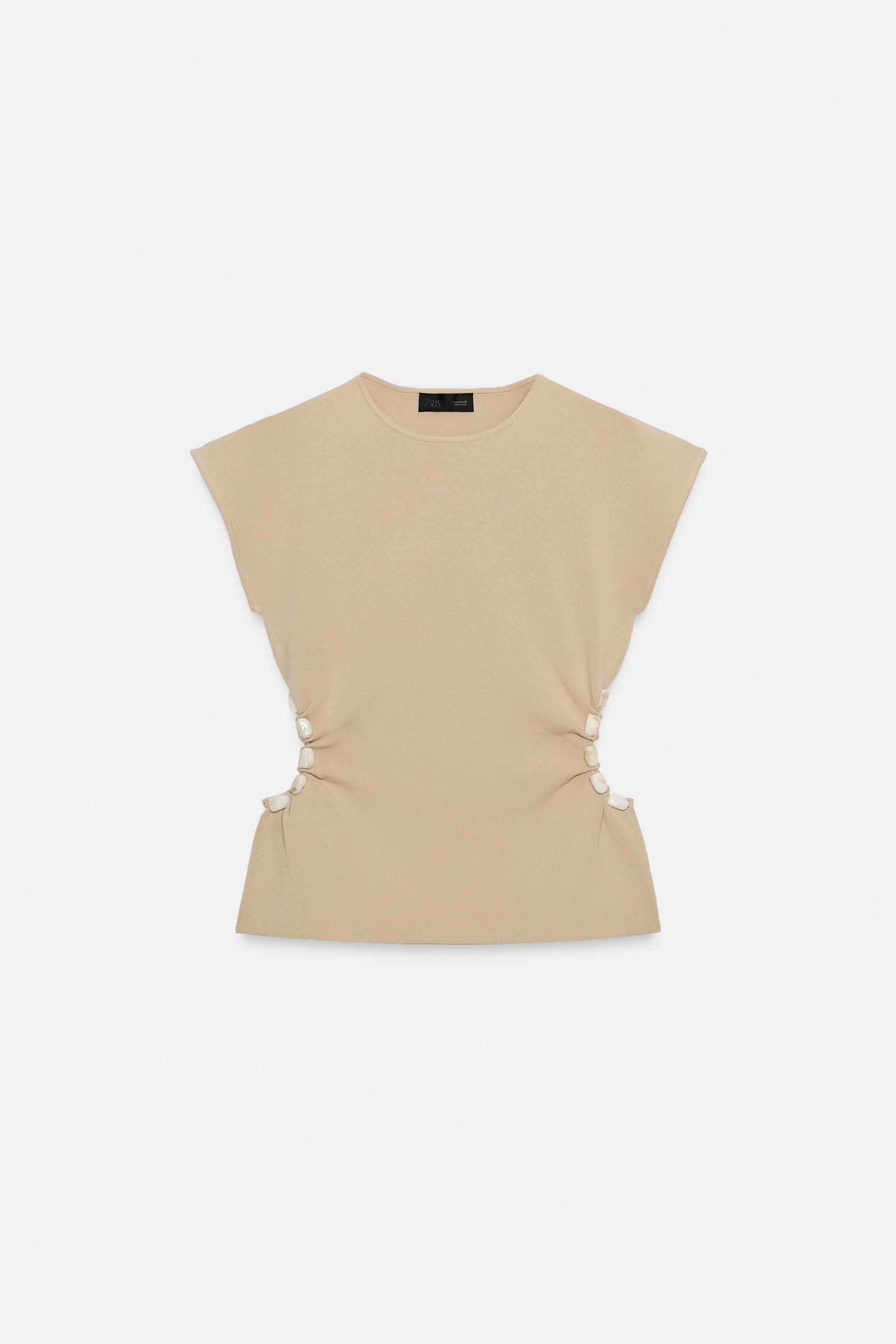 CUT OUT BEADED KNIT TOP