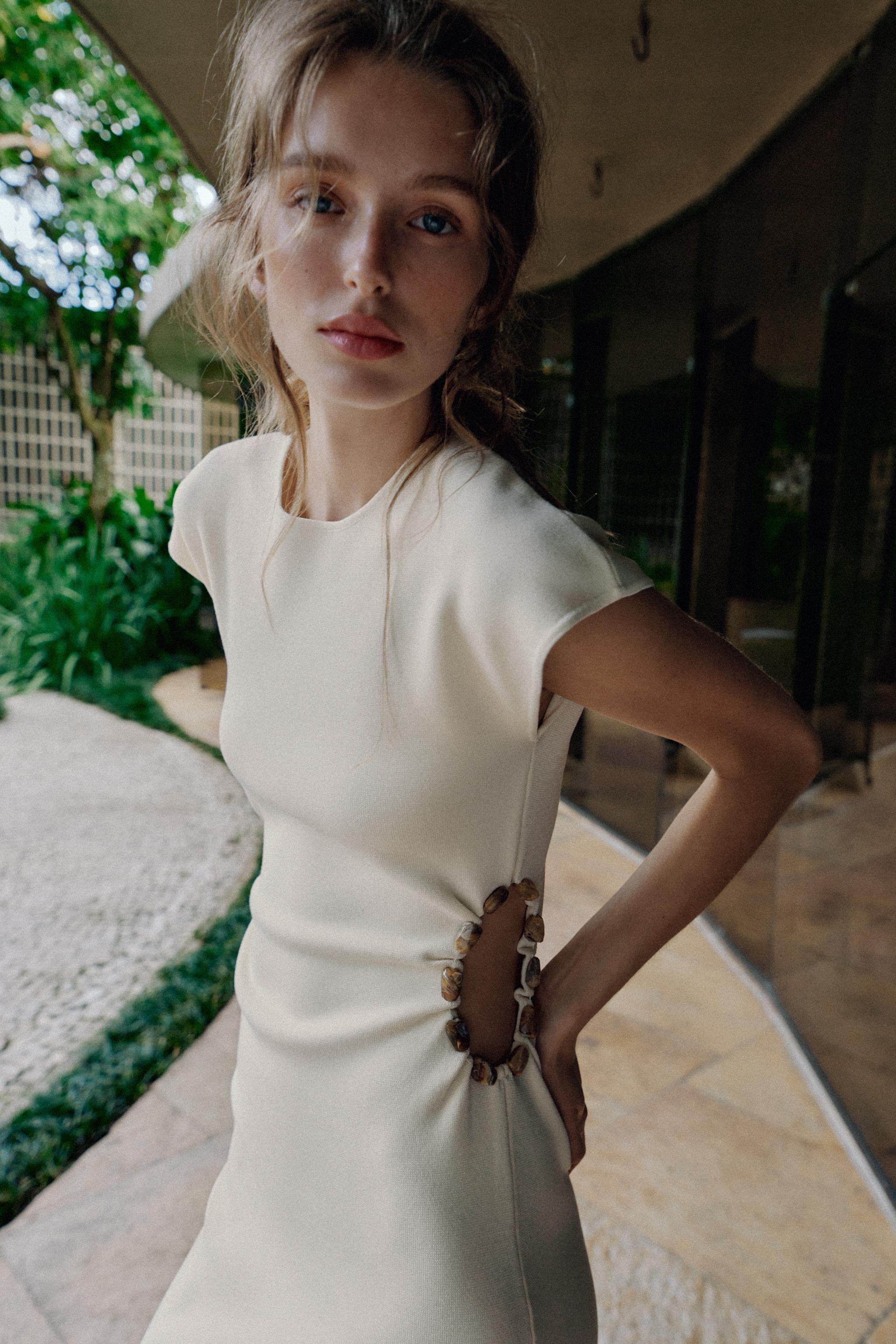 KNIT CUT OUT DRESS WITH BALLS